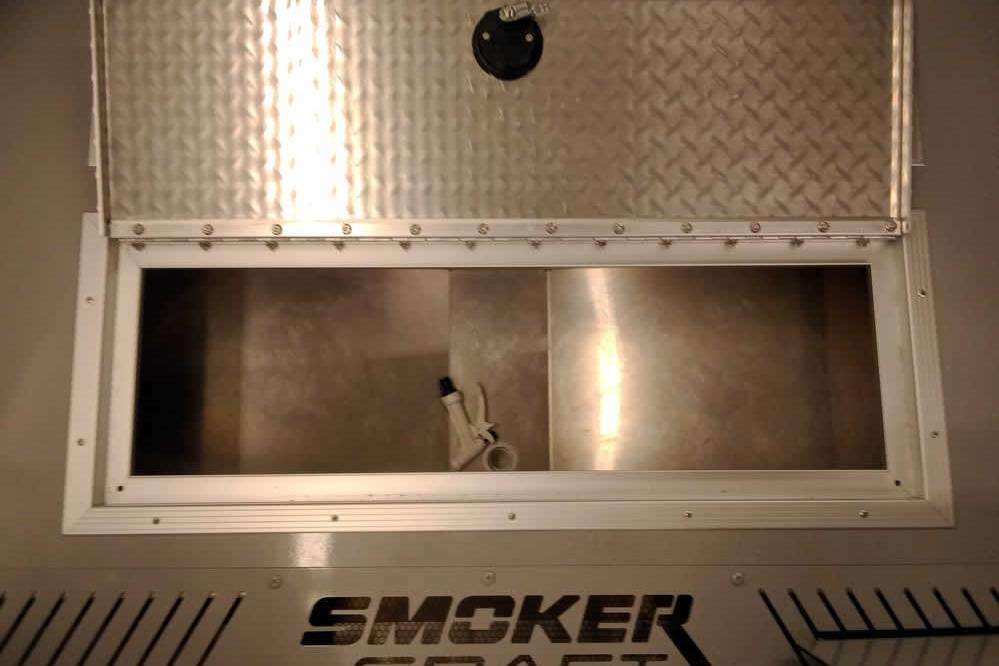 2026 Smoker Craft Phantom 20 X2 Offshore boat storage compartment with open hatch.