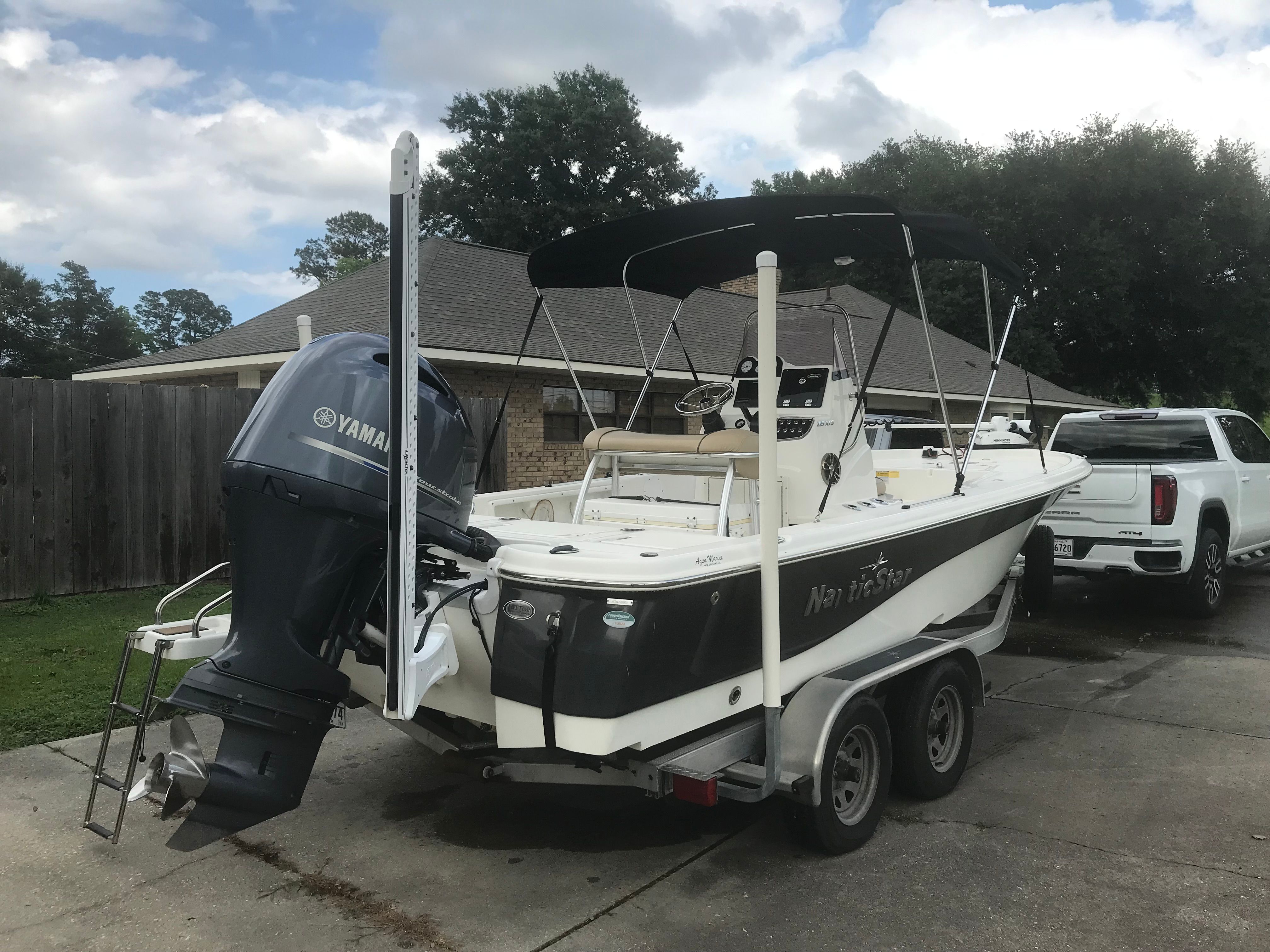 2020 NauticStar 215 XTS boat on trailer with Yamaha engine.
