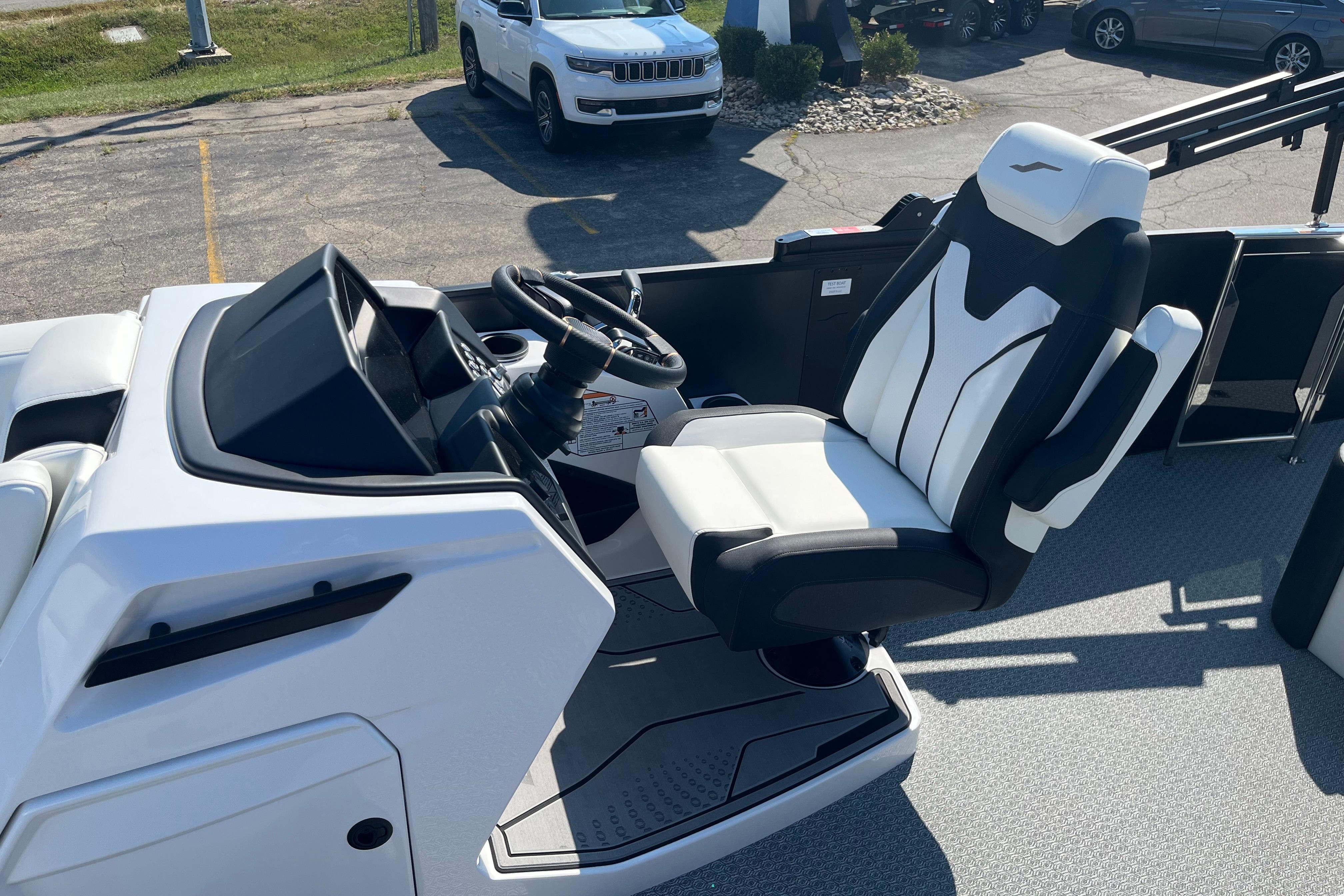 2026 Evotti 725CS boat interior with modern steering and comfortable seating.