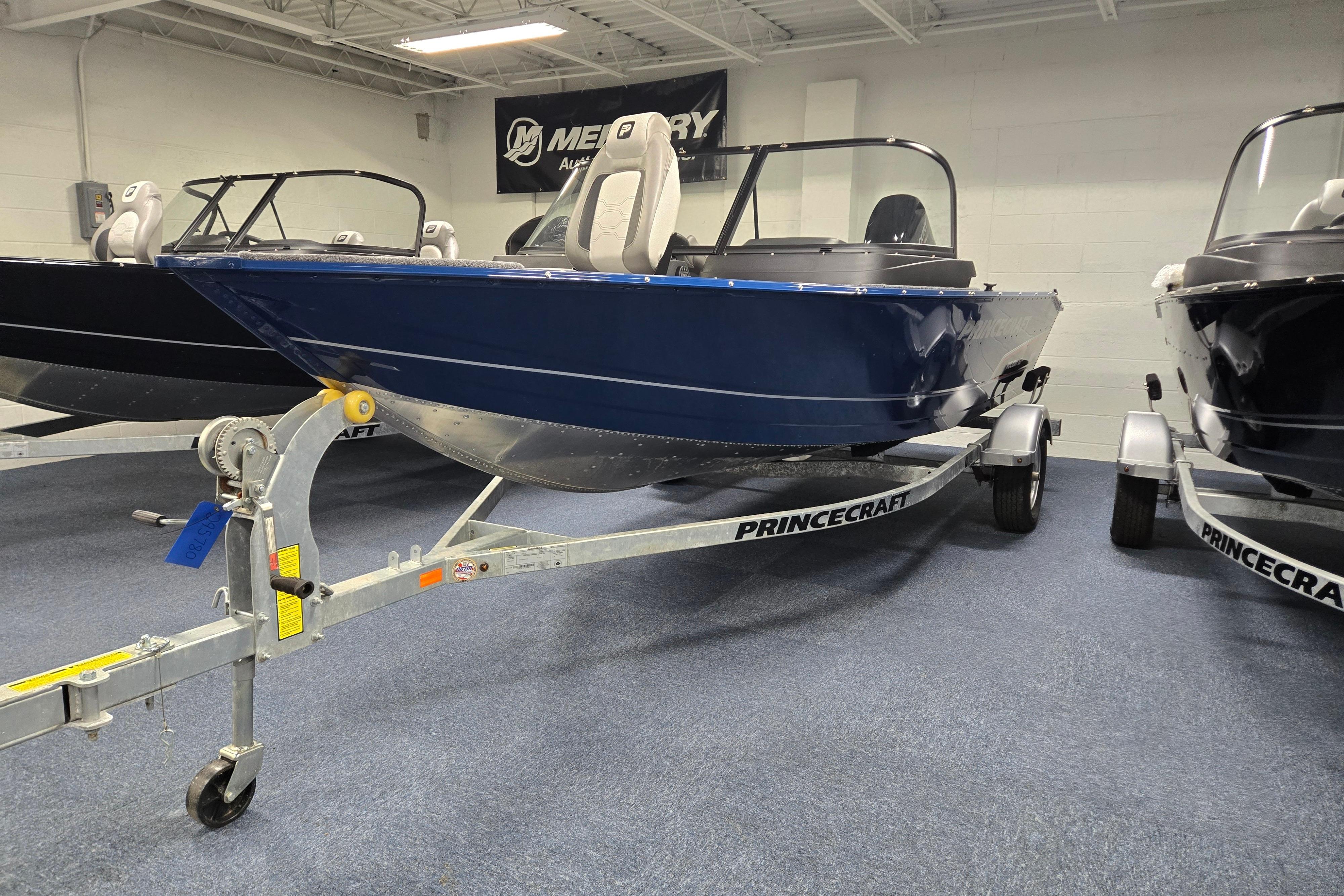 2026 Princecraft Holiday 162 WS MAX boat on trailer in showroom.