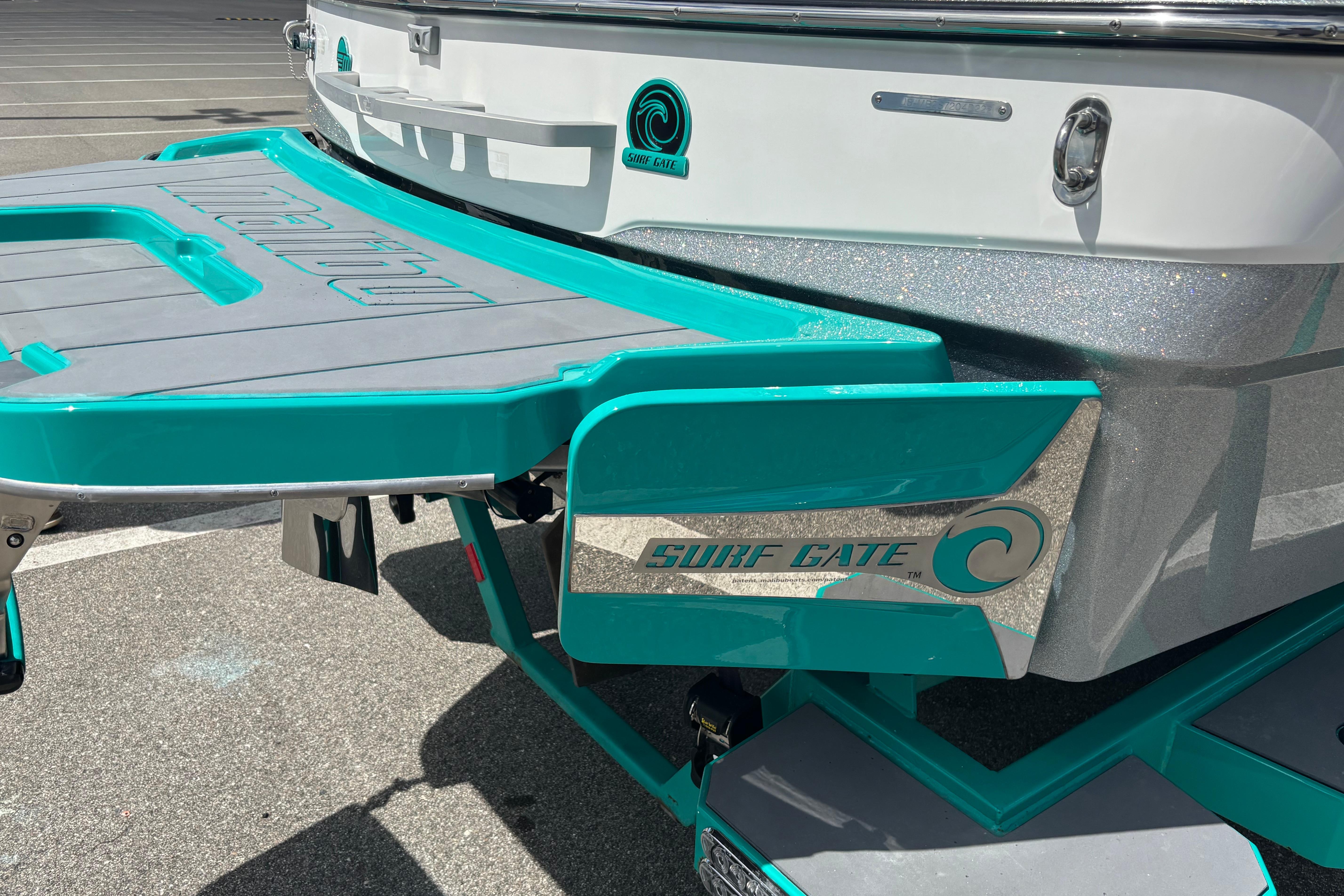 2022 Malibu Wakesetter 23 LSV with Surf Gate feature, teal and gray design.