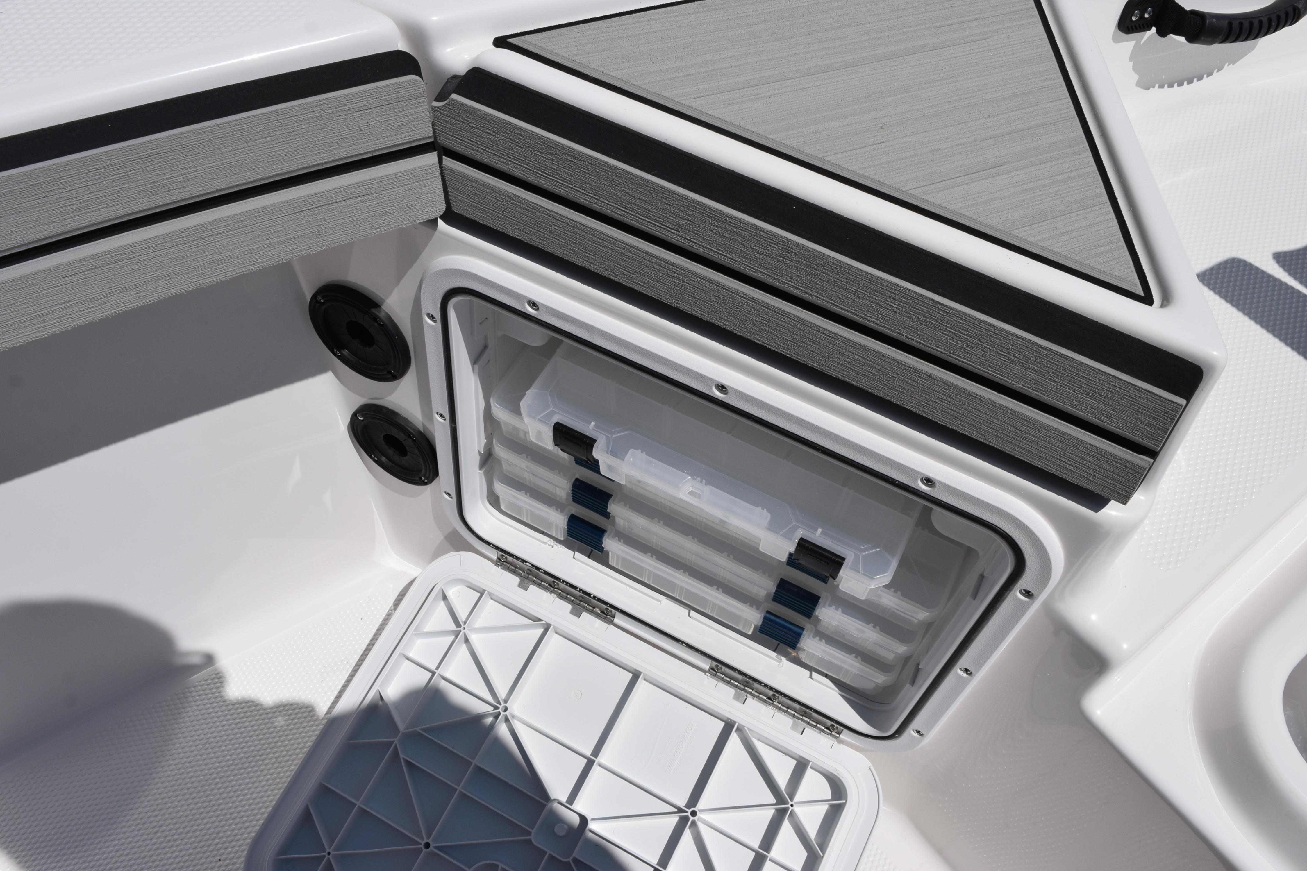Storage compartment on 2026 Yamaha Boats 190 FSH Sport, featuring organized tackle boxes.