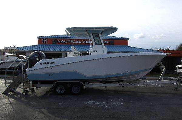 2025 Wellcraft 243 Fisherman boat on trailer at Nautical Ventures dealership.