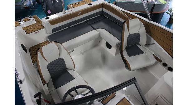 2025 Starcraft SVX 190 OB DC boat interior with modern seating and steering wheel.