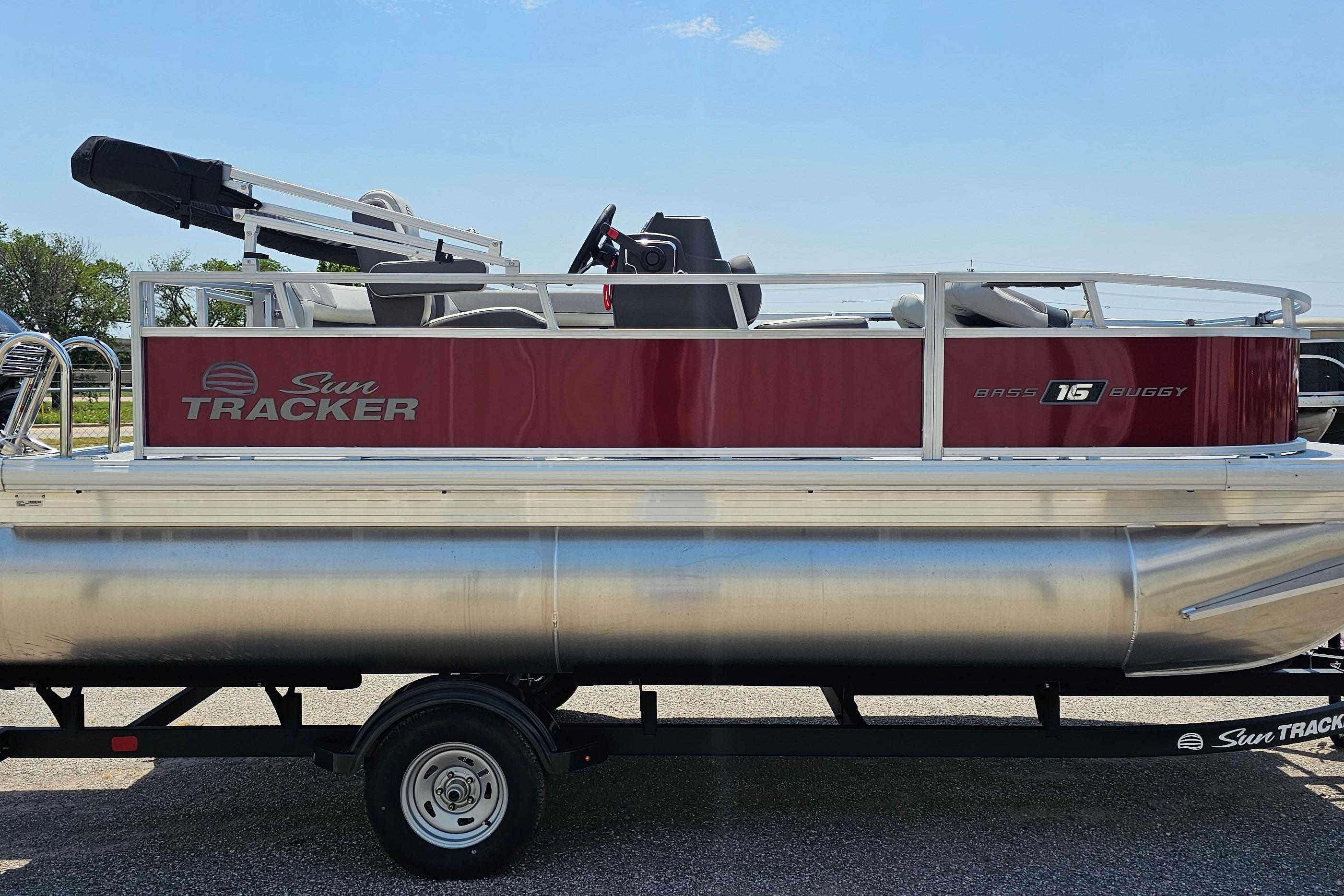 2026 Sun Tracker Bass Buggy 16 XL Select pontoon boat on trailer, side view.