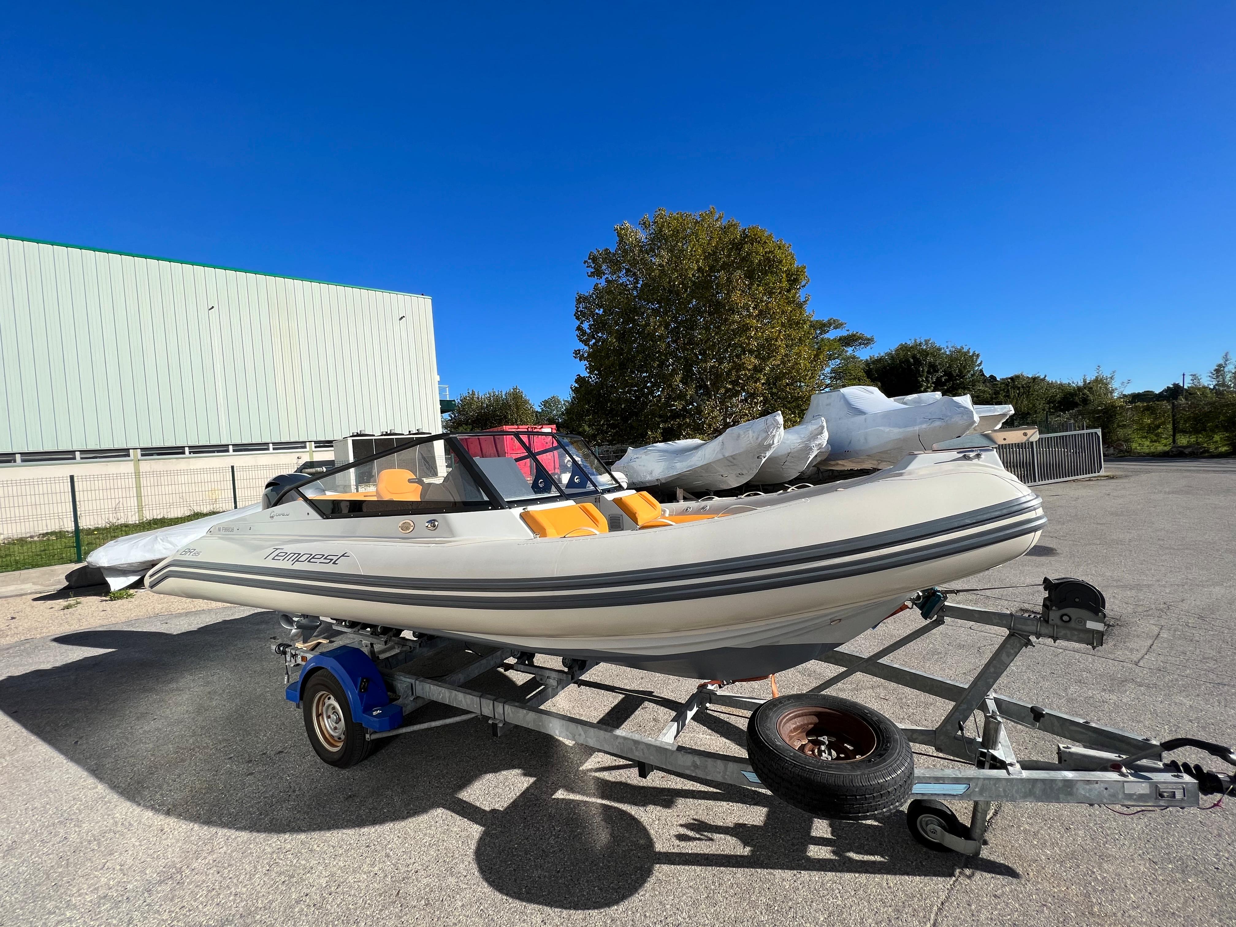 2020 Capelli Tempest 650 BR boat on trailer under clear blue sky.