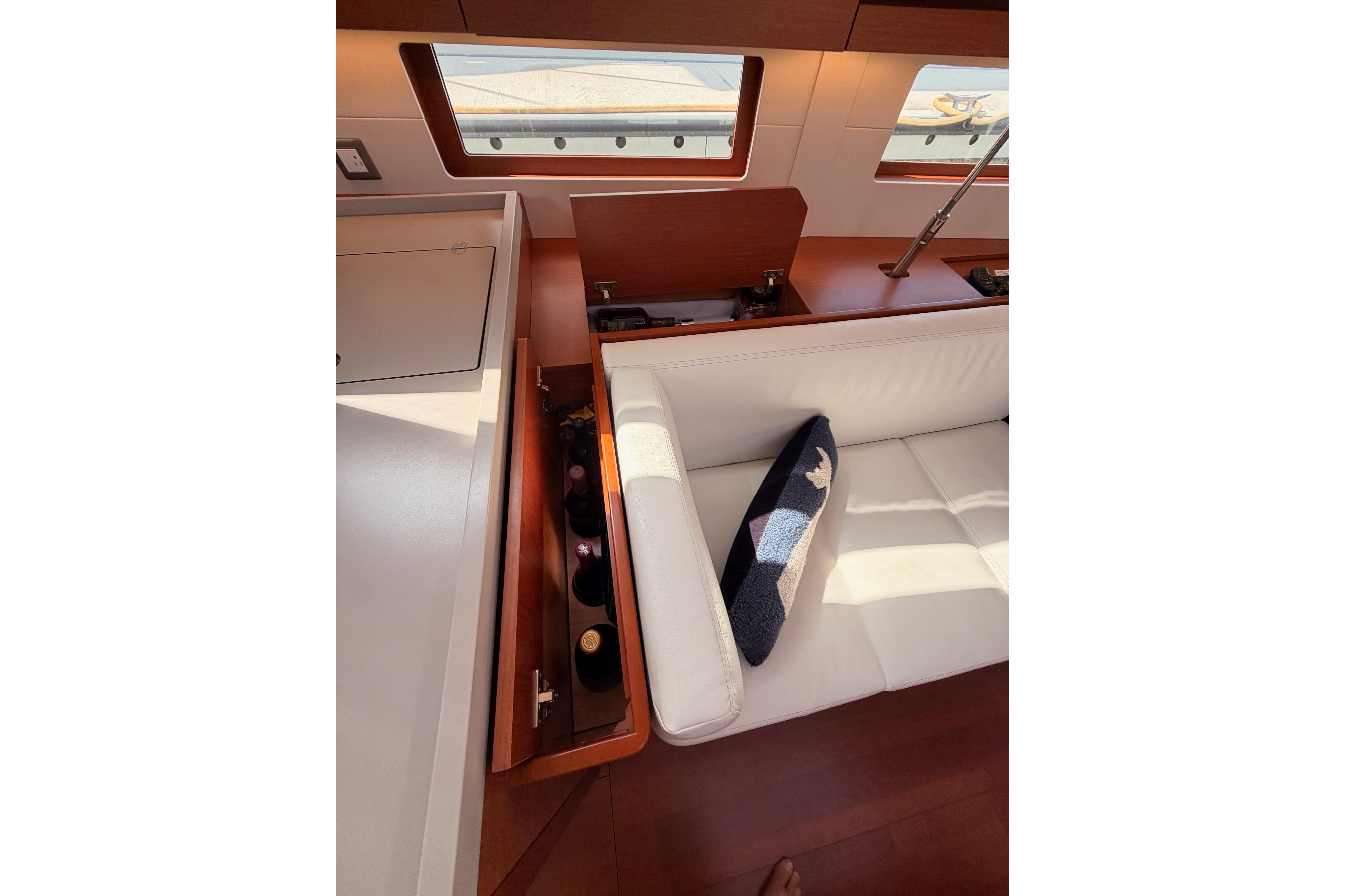 Interior of 2020 Beneteau Oceanis 46.1 yacht with white seating and storage.