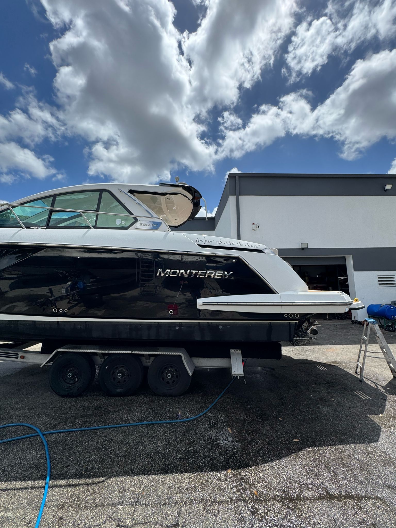 2015 Monterey 360 Sport Coupe on trailer under cloudy sky.