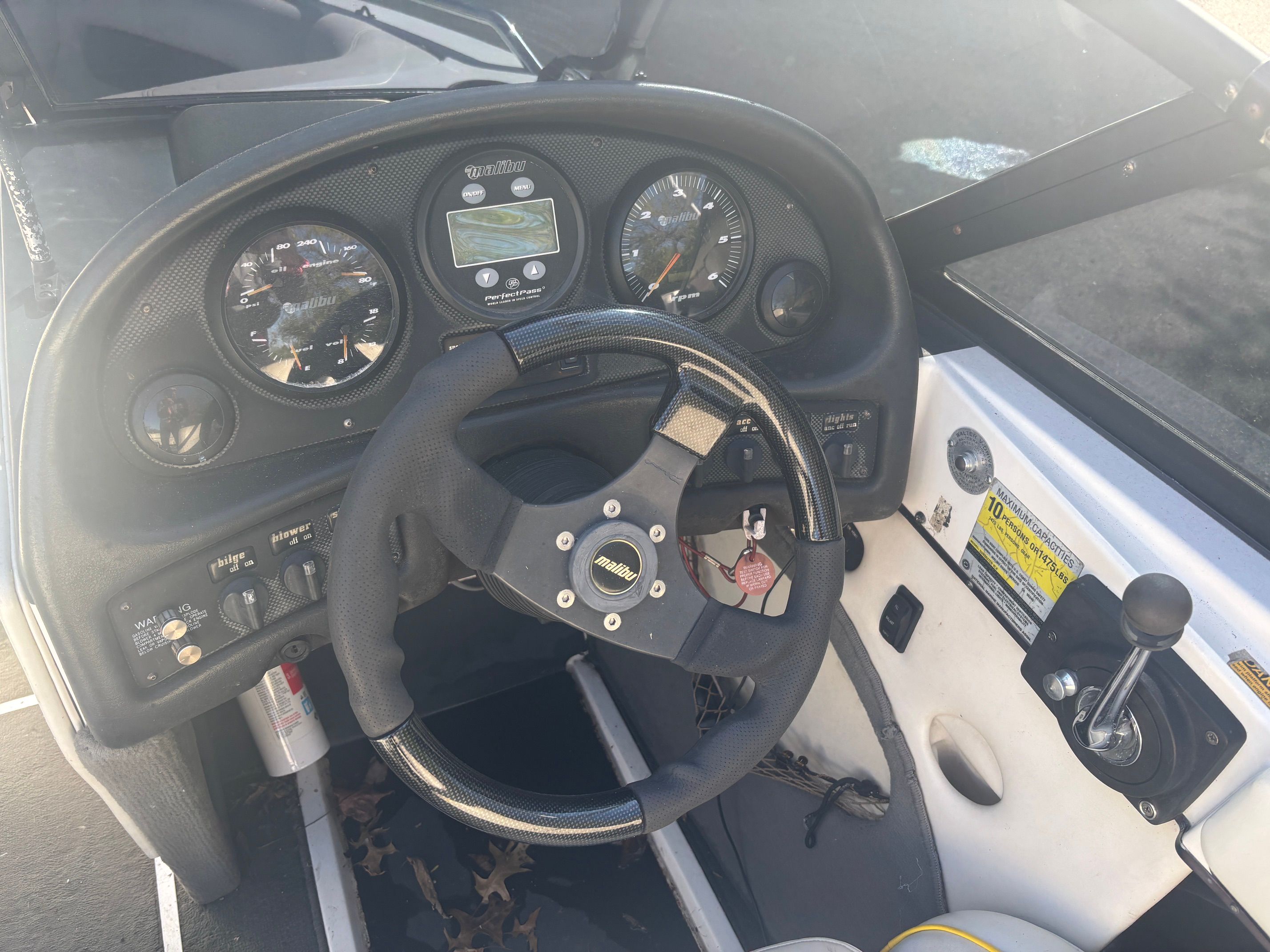 Interior view of a 2000 Malibu Wakesetter VLX boat cockpit.