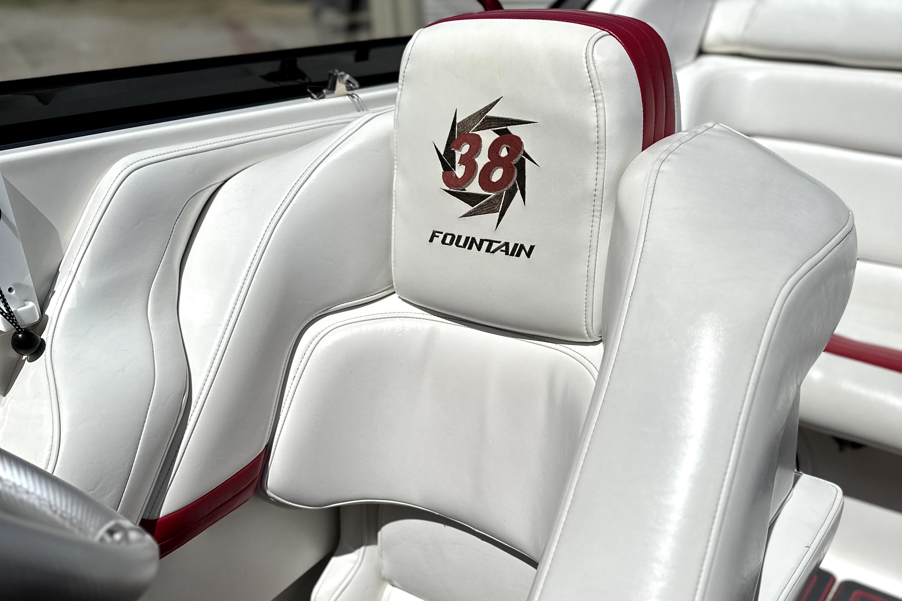 2003 Fountain 38 Lightning boat interior with white and red upholstery.