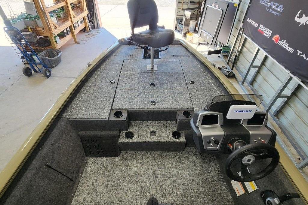 Interior of a 2026 Tracker Pro Team 195 boat with steering console and seating.