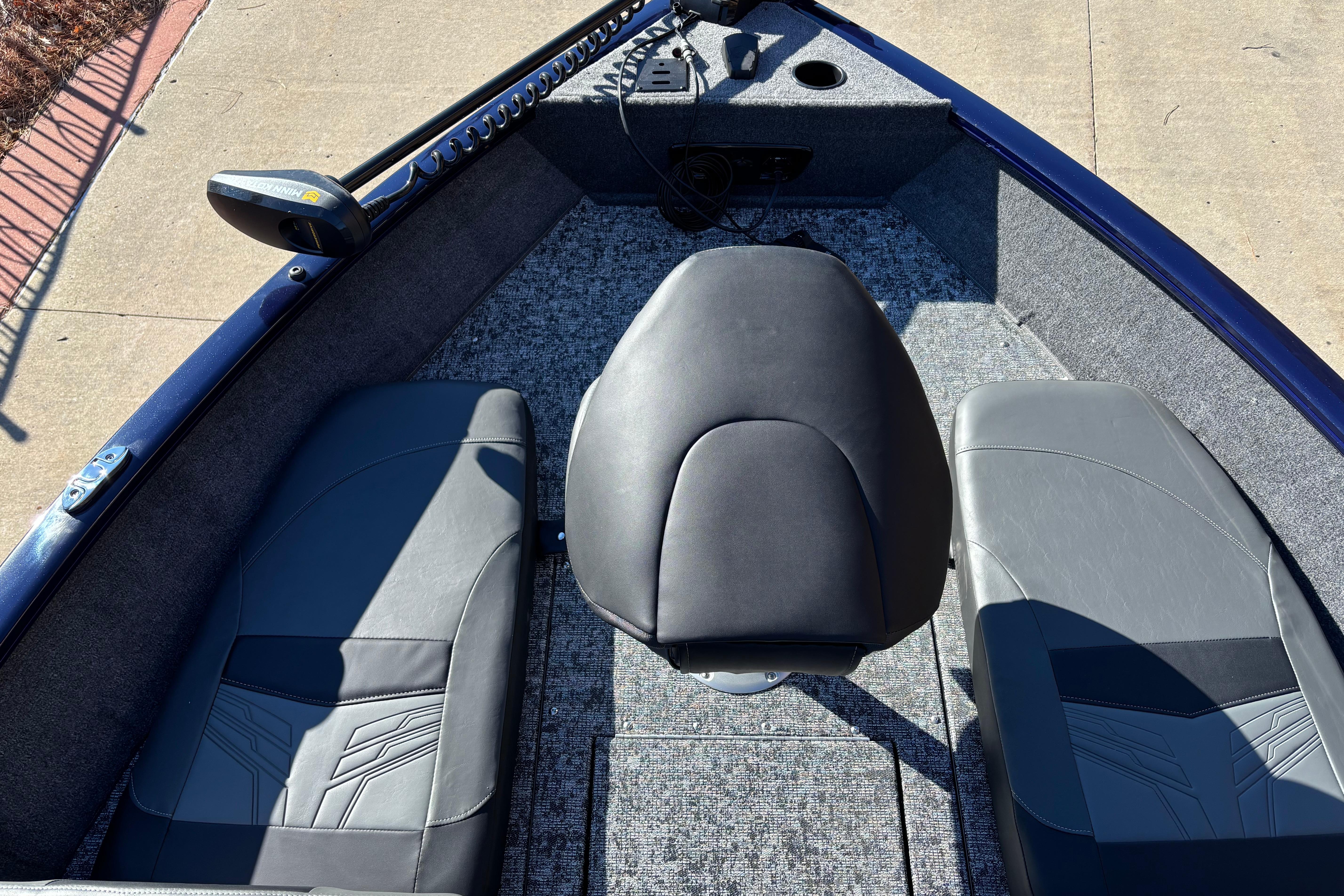 2026 Tracker Pro Guide V-175 Combo boat interior with seating and control panel.