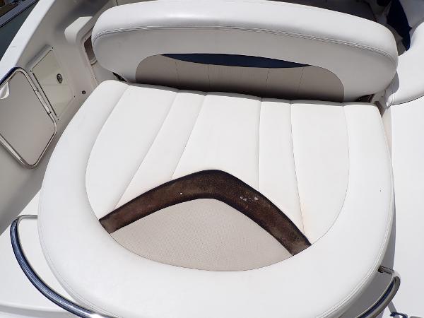 White leather seat on 2011 Chaparral 287 SSX boat, showing wear and discoloration.