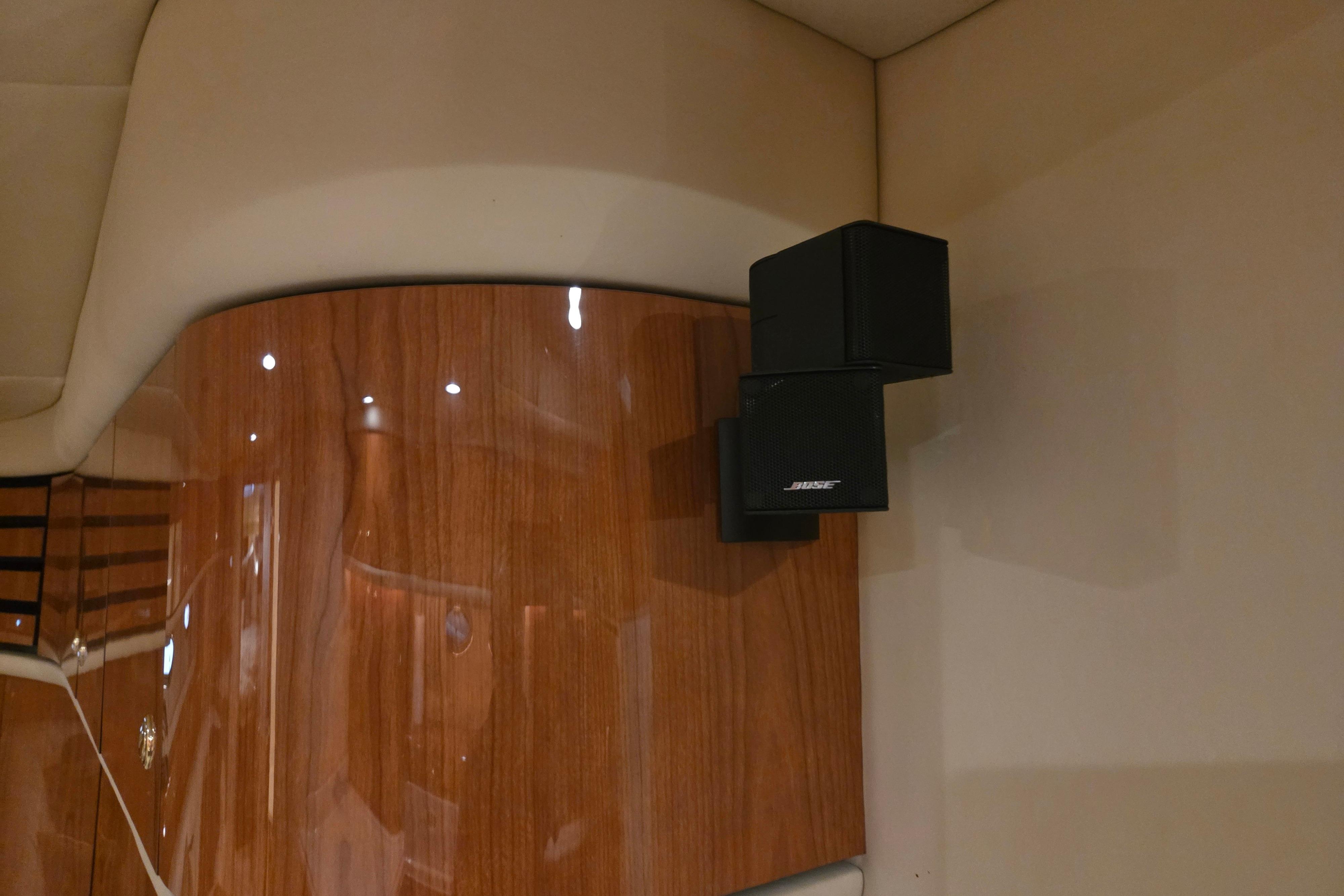 Bose speakers mounted on wood panel inside 2000 Sea Ray Sundancer 540 yacht.