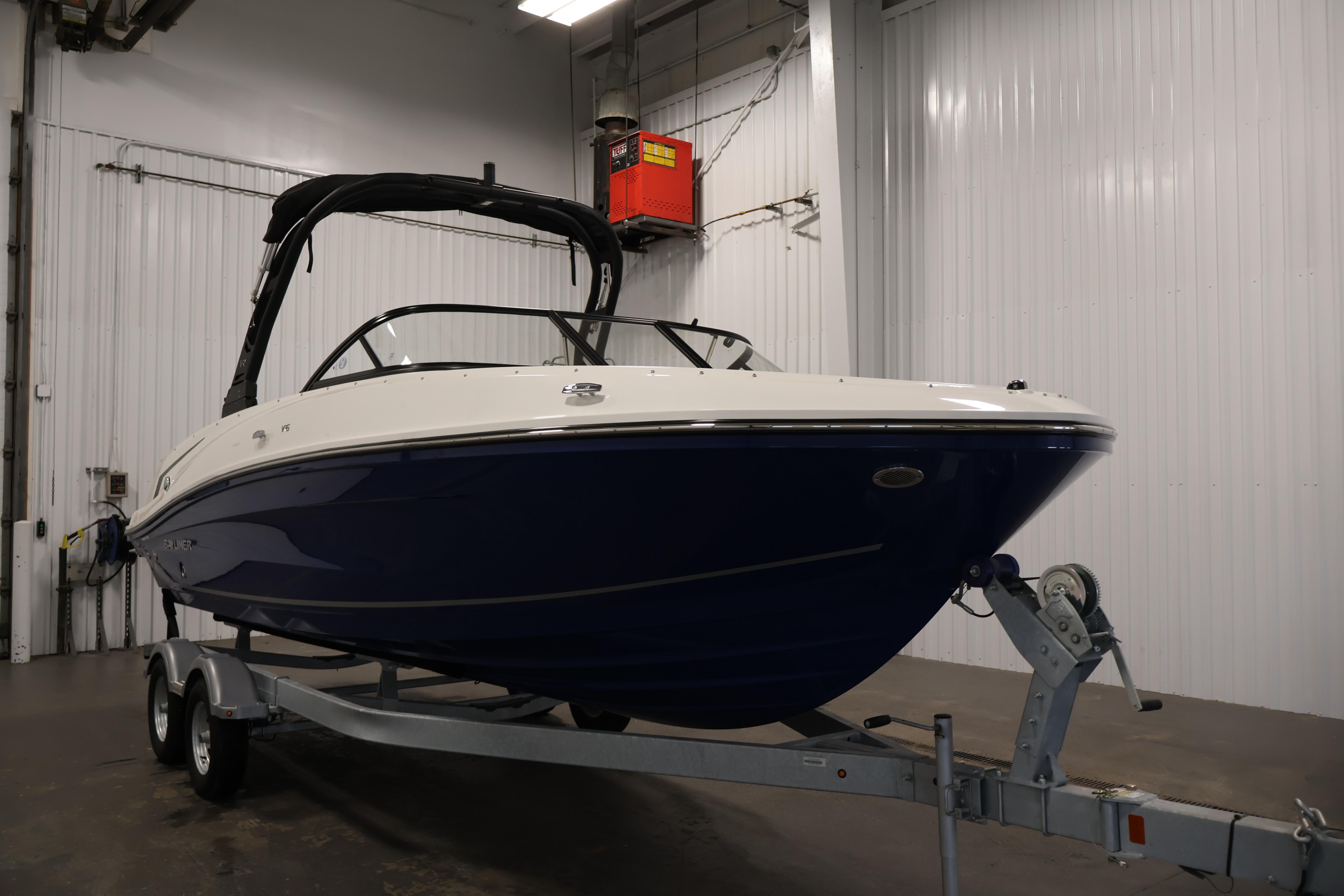 2026 Bayliner VR6 Bowrider I/O on trailer in indoor storage facility.