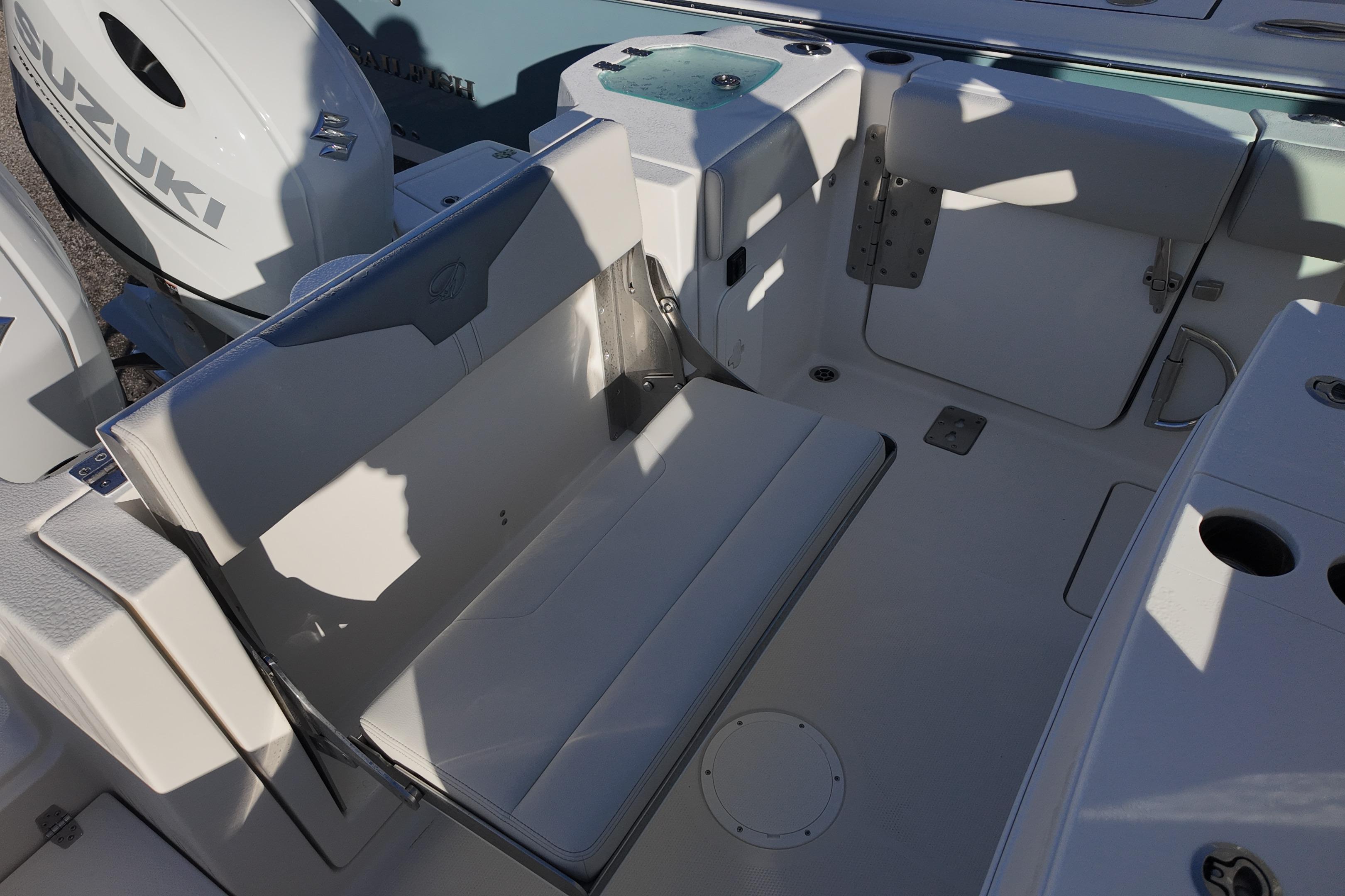 2026 Sailfish 272 CC boat interior with seating and Suzuki engines.