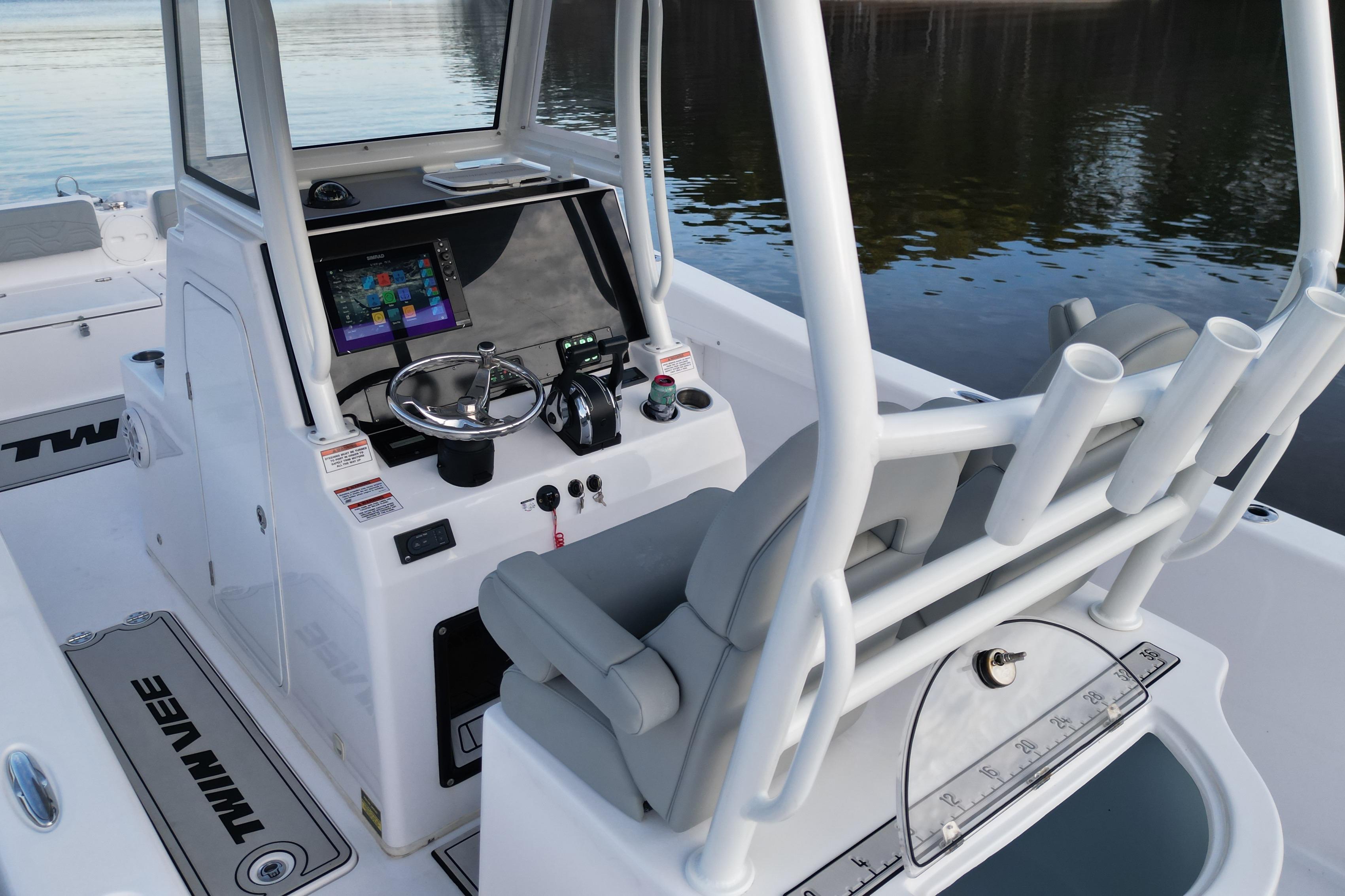 2023 Twin Vee 260 GFX CC boat interior with modern console and seating.