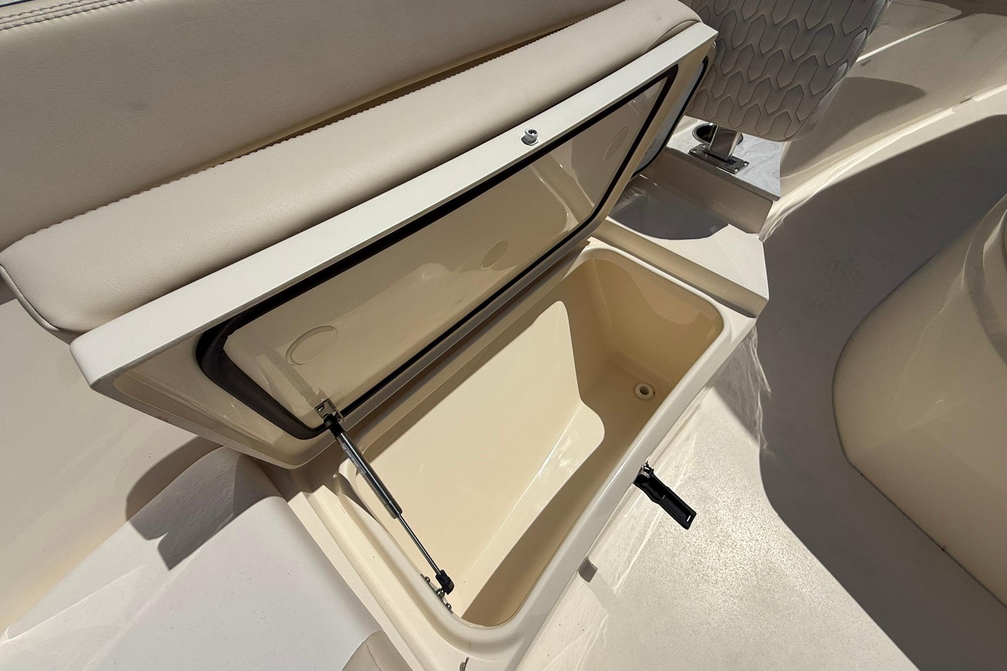Open storage compartment on 2027 Scout 240 XSF boat, showcasing interior design and functionality.