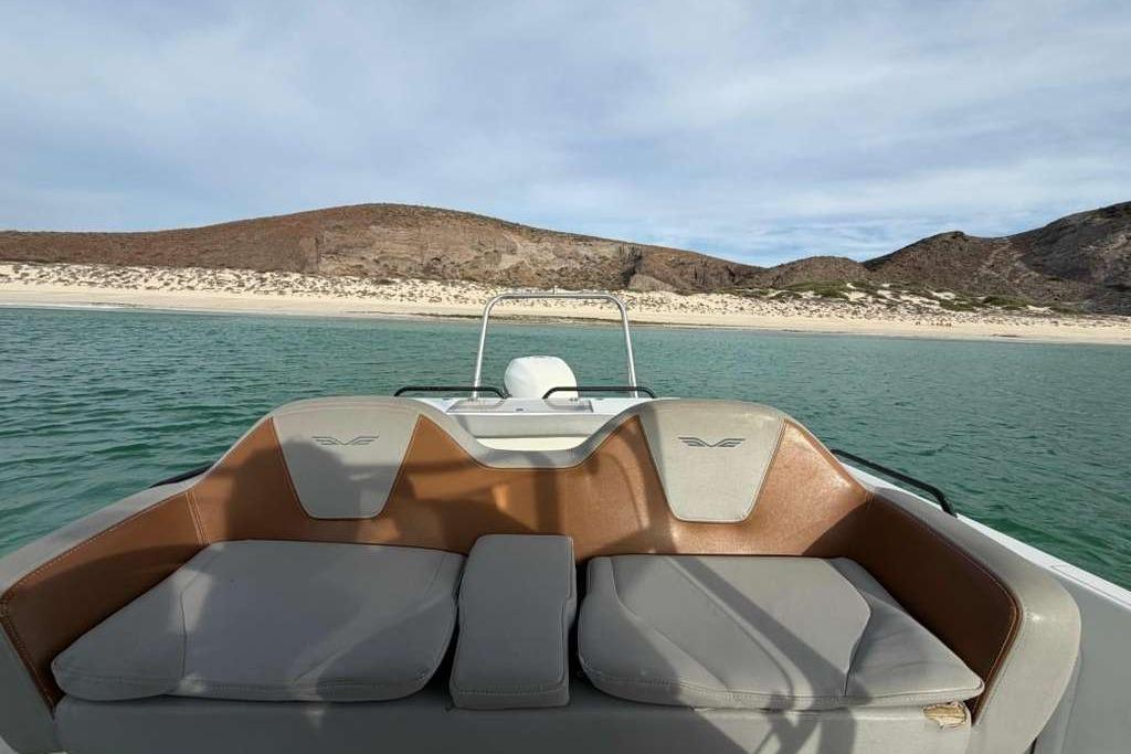 Lagoon 630 MY 2019 yacht interior with scenic coastal view.