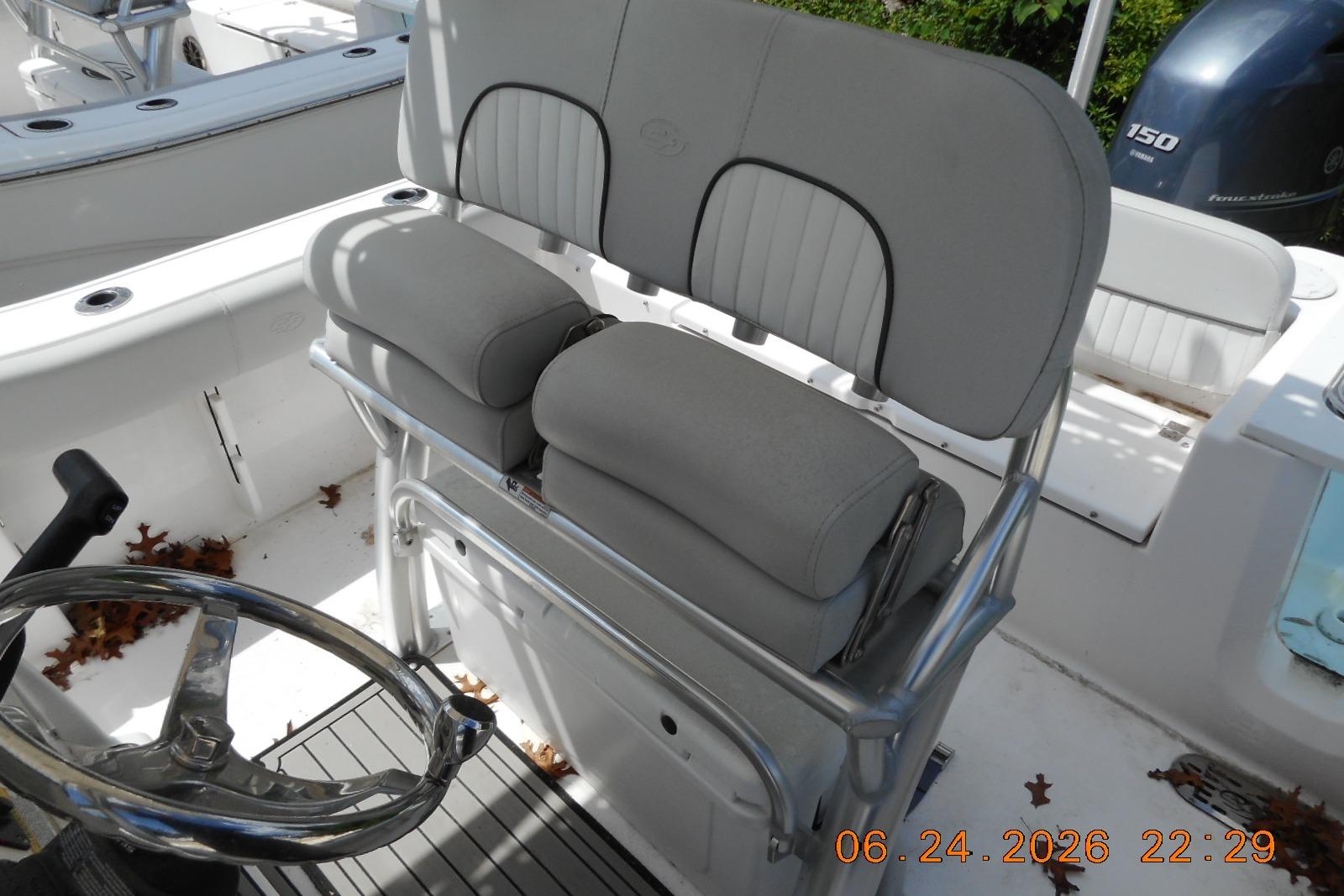 2022 Sea Fox 228 Commander boat interior with helm seat and steering wheel.