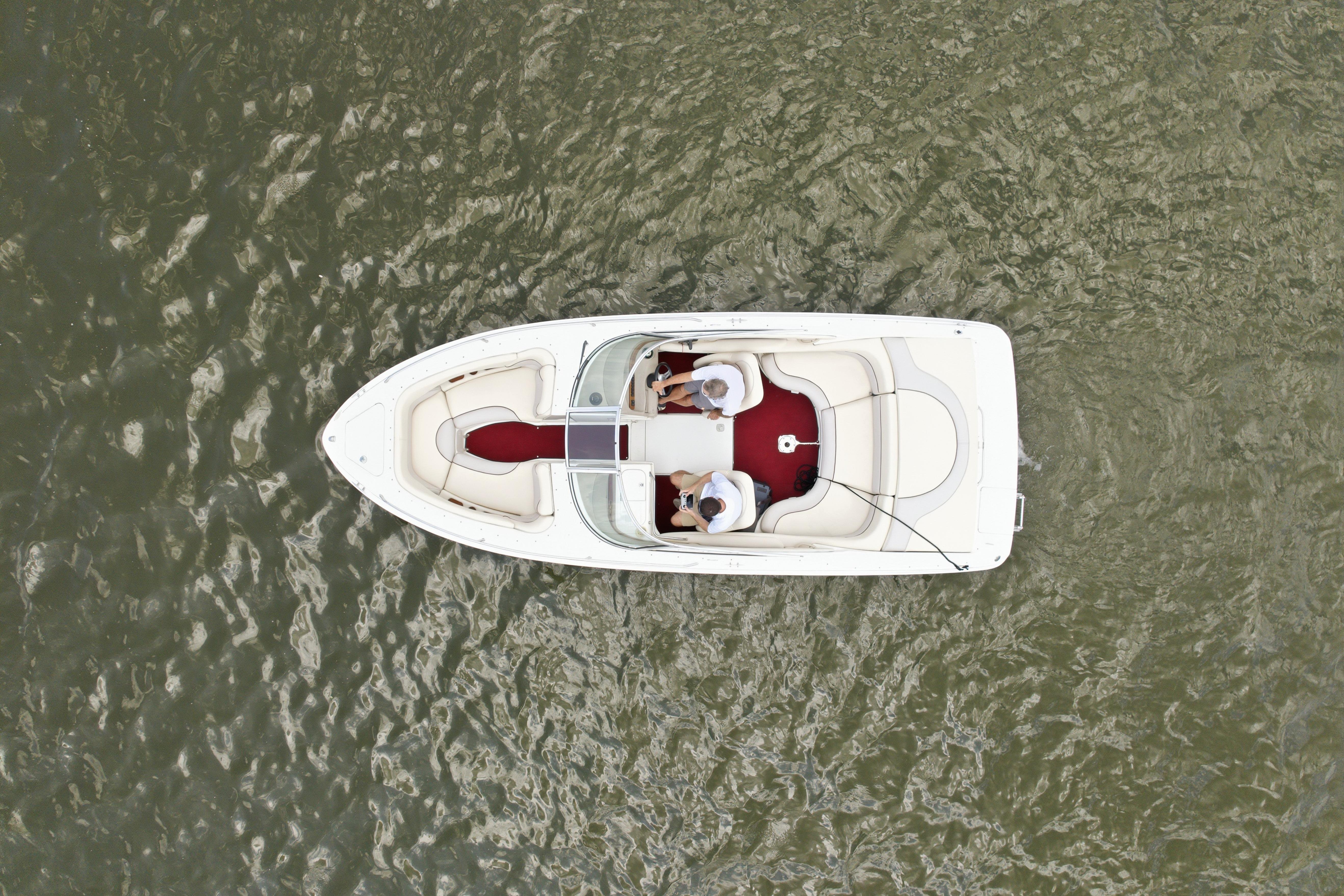 Overhead view of 1997 Sea Ray 230 Signature boat on water.