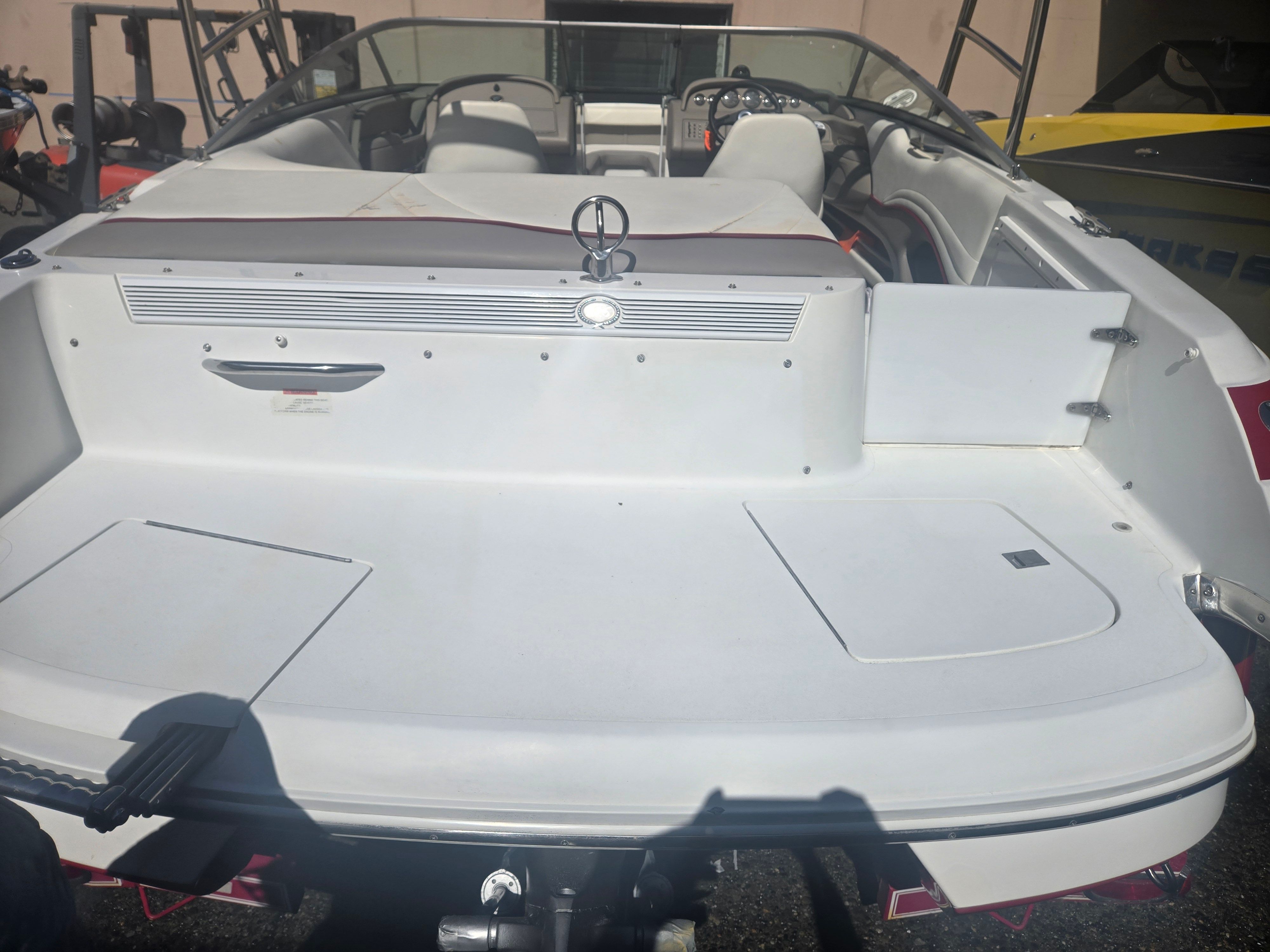 Rear view of a 2001 Cobalt 226 boat in sunlight.