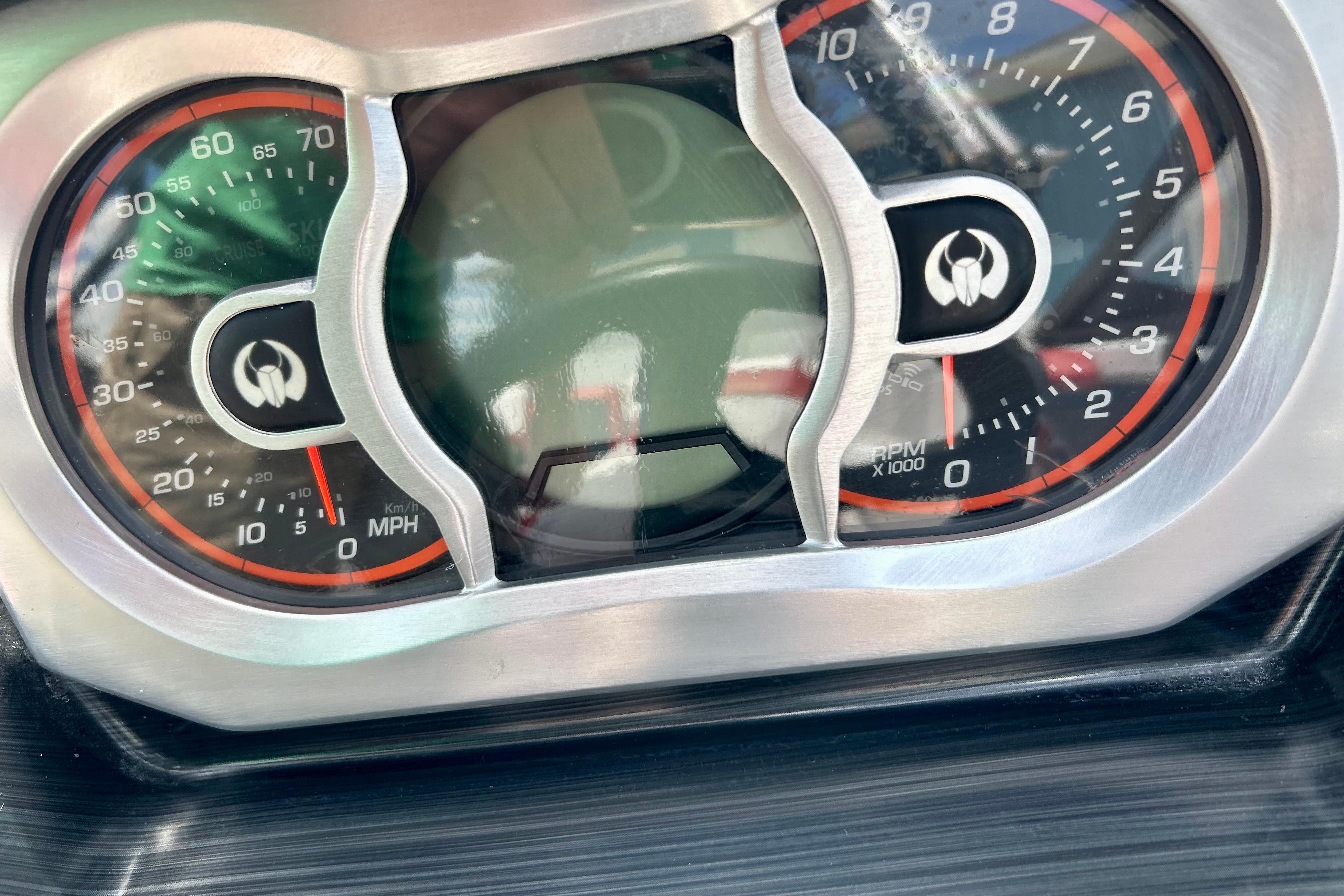 Dashboard of a 2021 Scarab 195 ID boat, showing speedometer and tachometer.