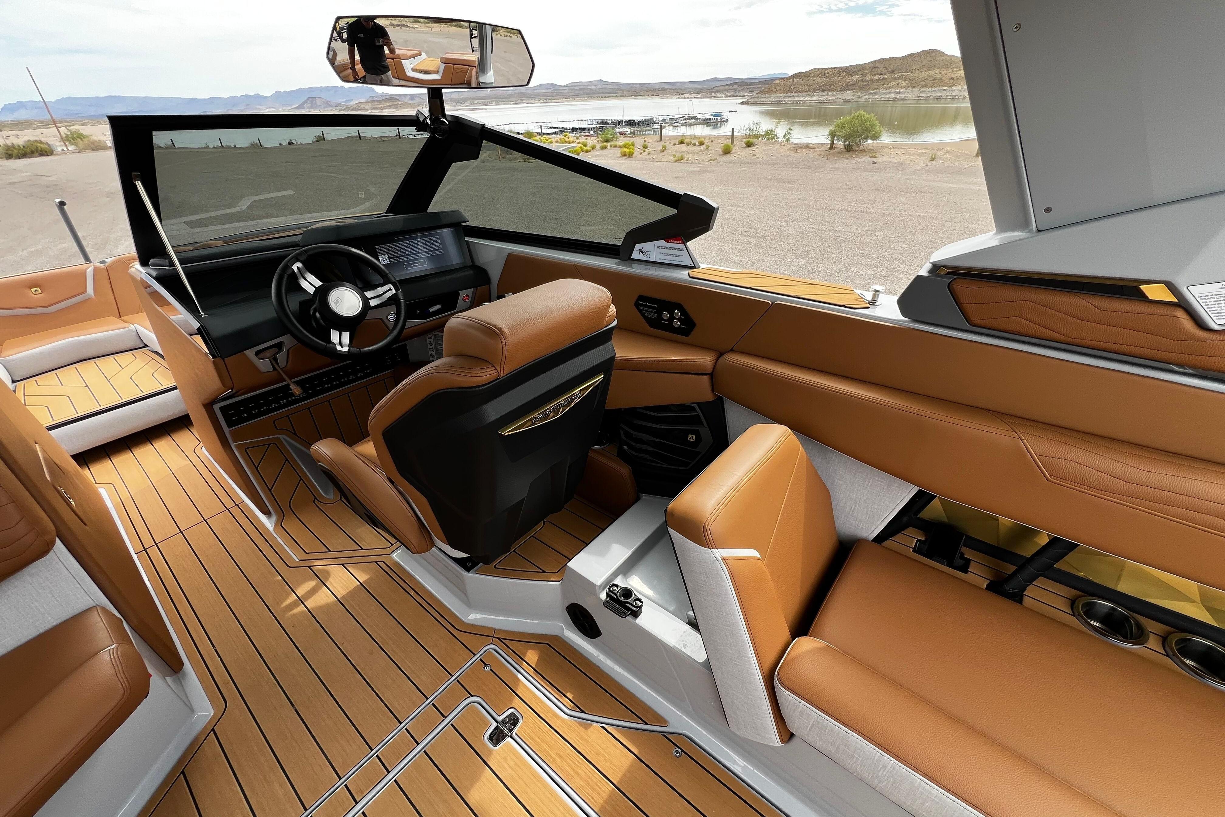 2026 Nautique Super Air Nautique G25 interior with luxurious seating and modern dashboard.