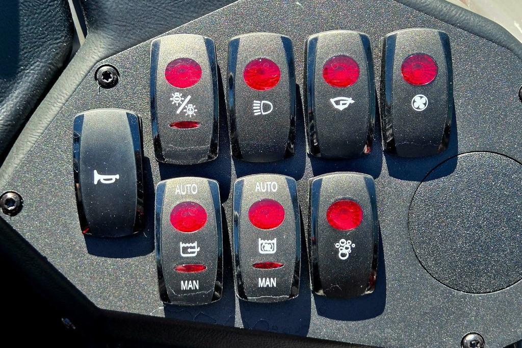 Control panel of a 2026 Skeeter ZXE20 boat with various switches and indicators.