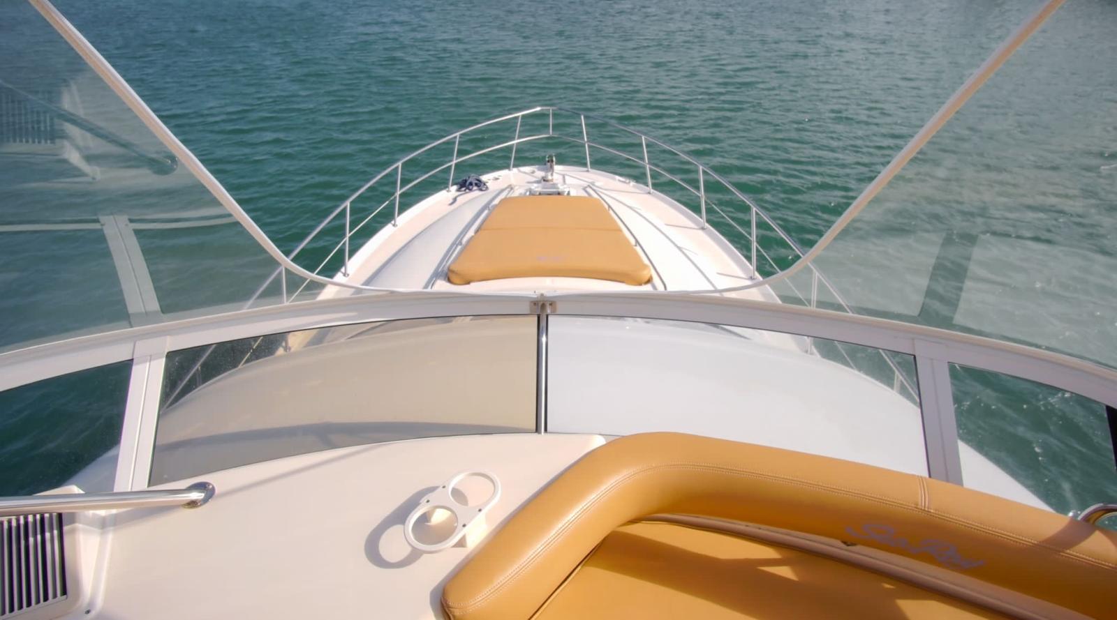 2001 Sea Ray 480 Sedan Bridge yacht on calm water, view from helm.