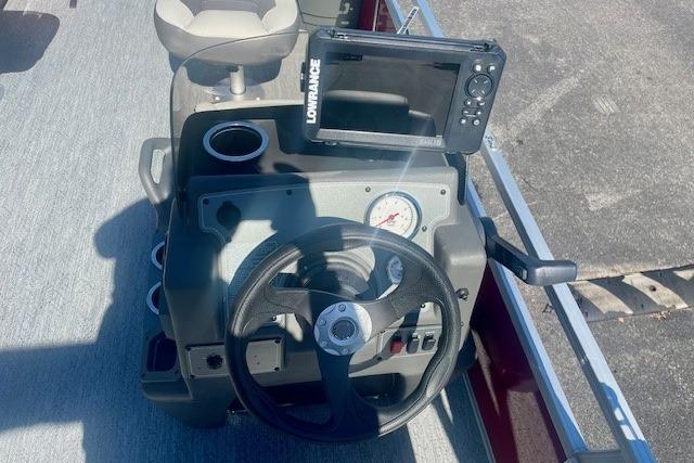 Steering console of 2026 Sun Tracker Bass Buggy 18 DLX with navigation system.
