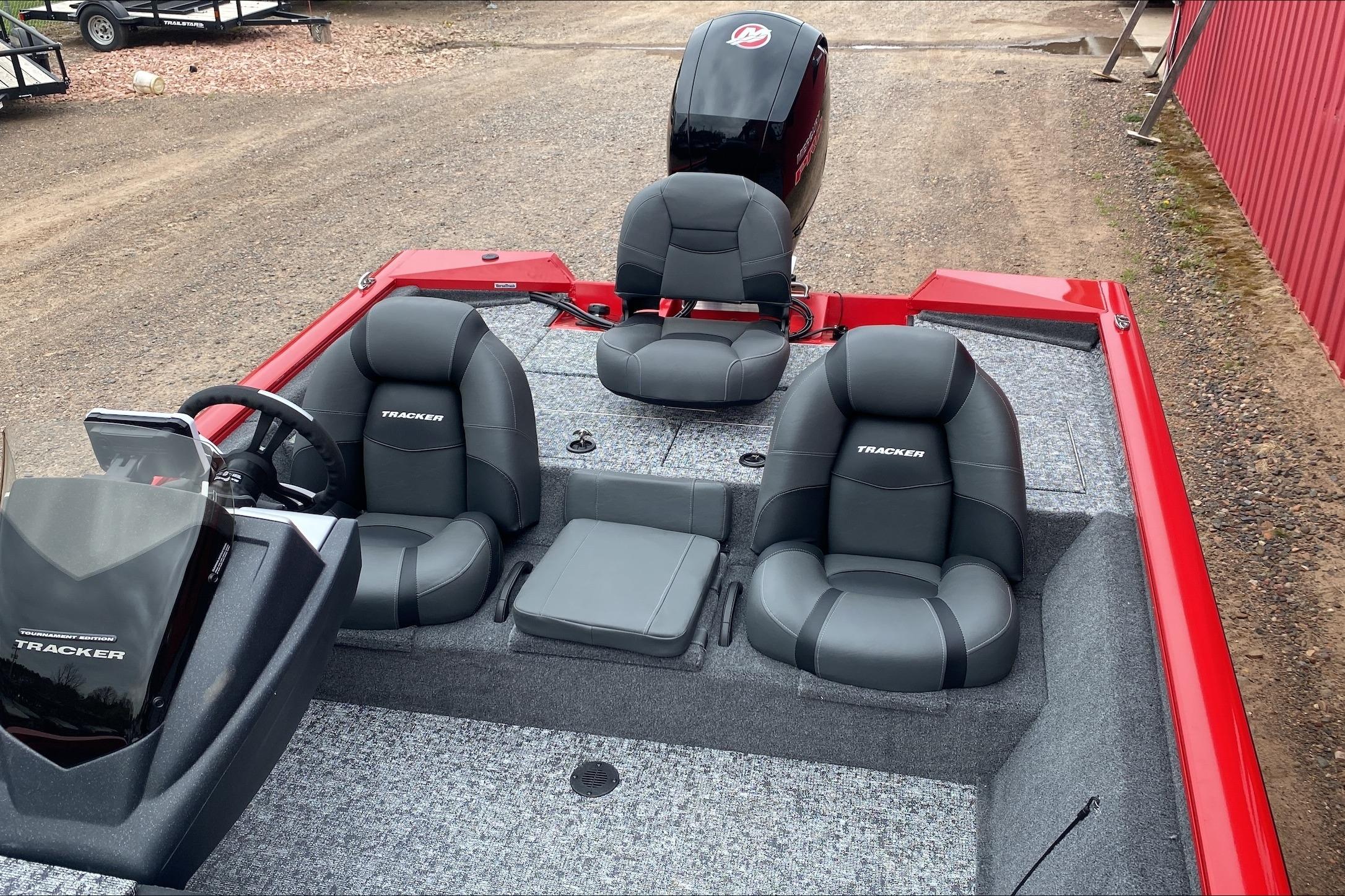 2026 Tracker Pro Team 195 boat interior with gray seating and red accents.