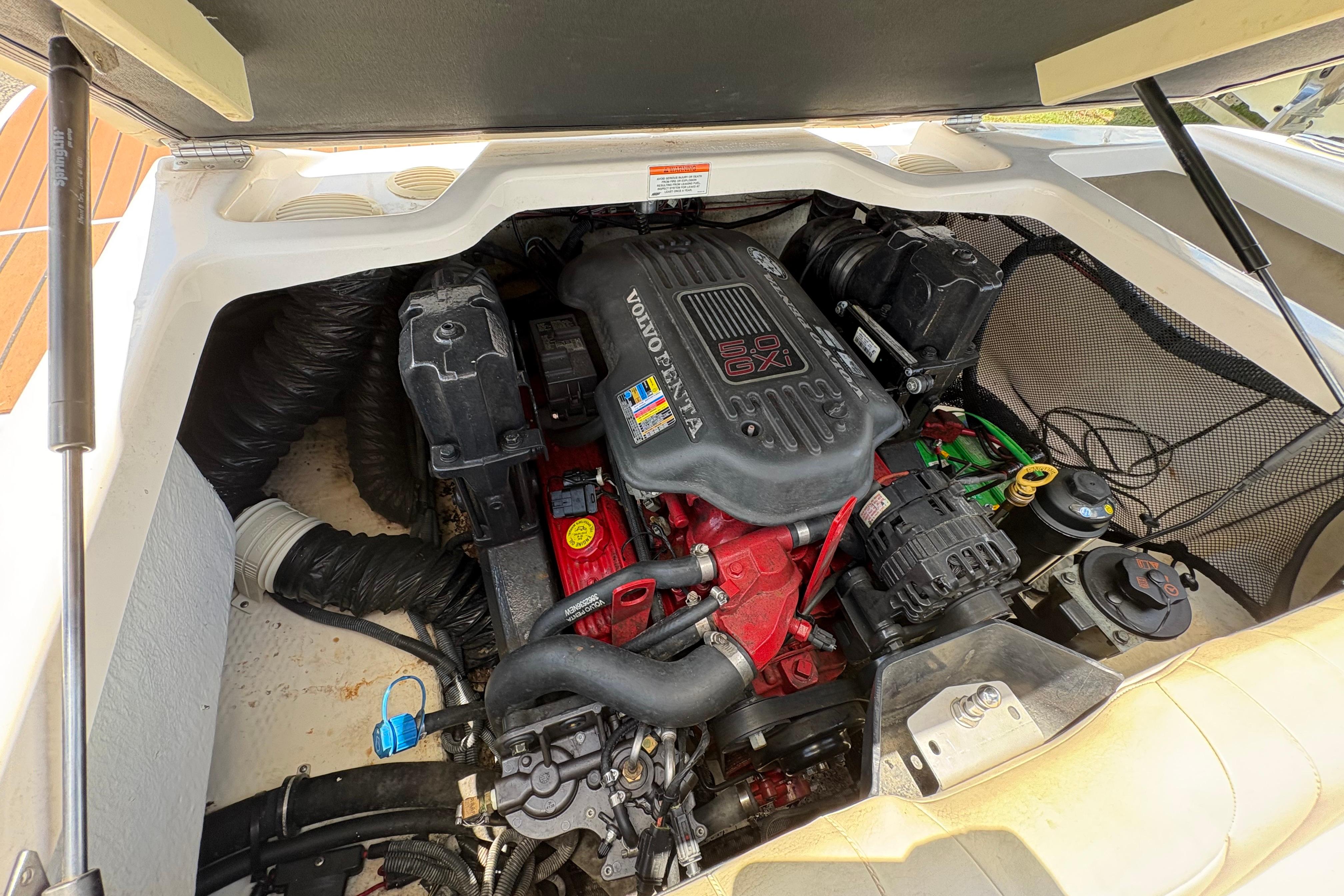Engine compartment of a 2008 Regal 1900 Bowrider boat, featuring a Volvo Penta 5.0 GXI engine.
