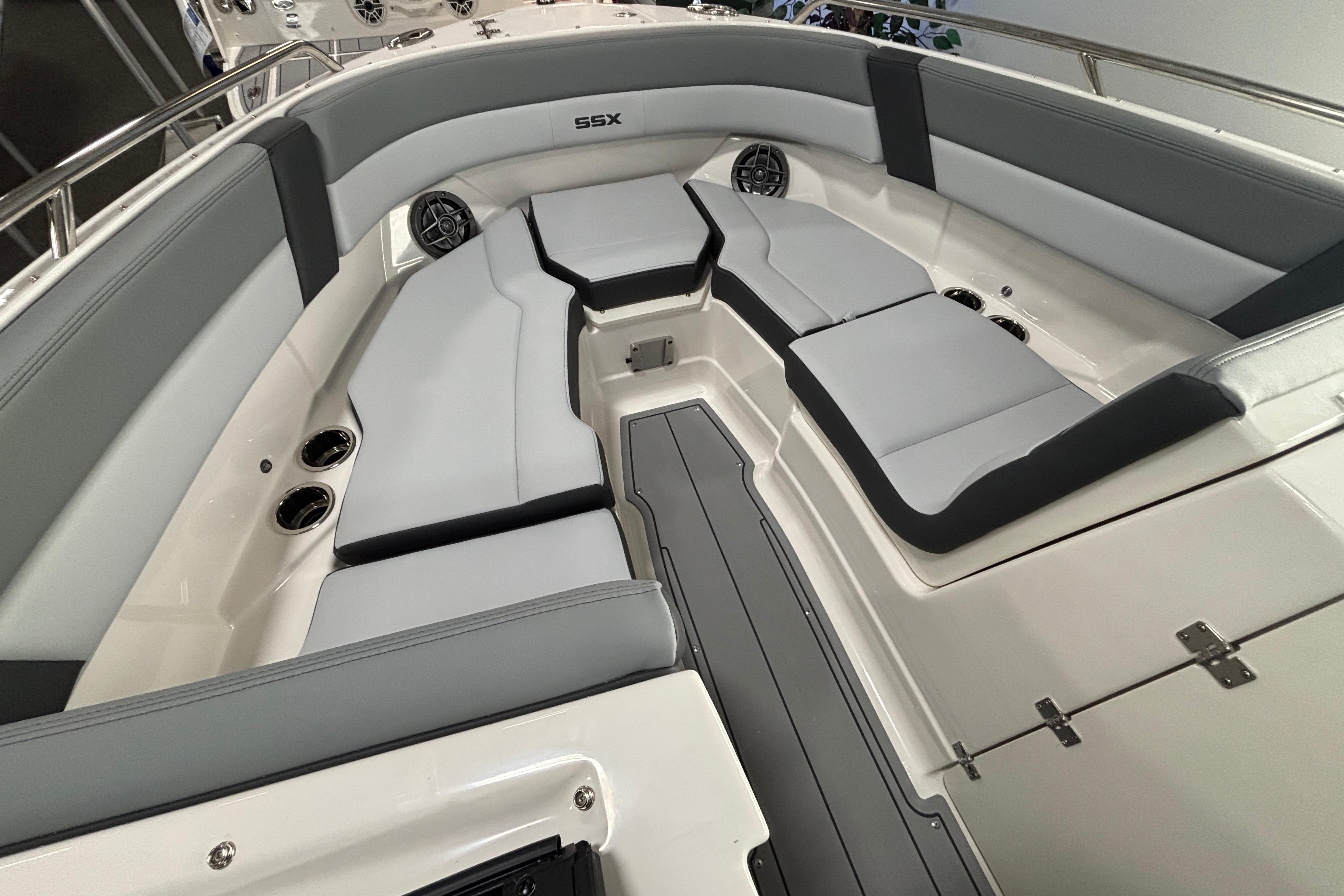 2026 Chaparral SSX 4 boat interior with gray seating and stainless steel accents.