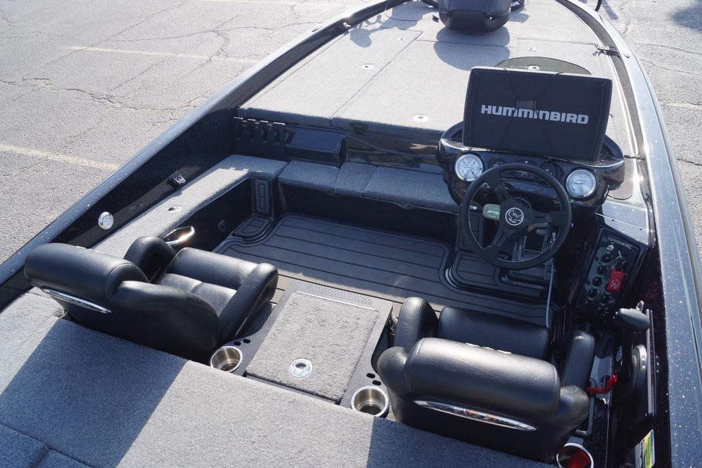2025 Phoenix 921 Elite boat interior with steering wheel and Humminbird display.
