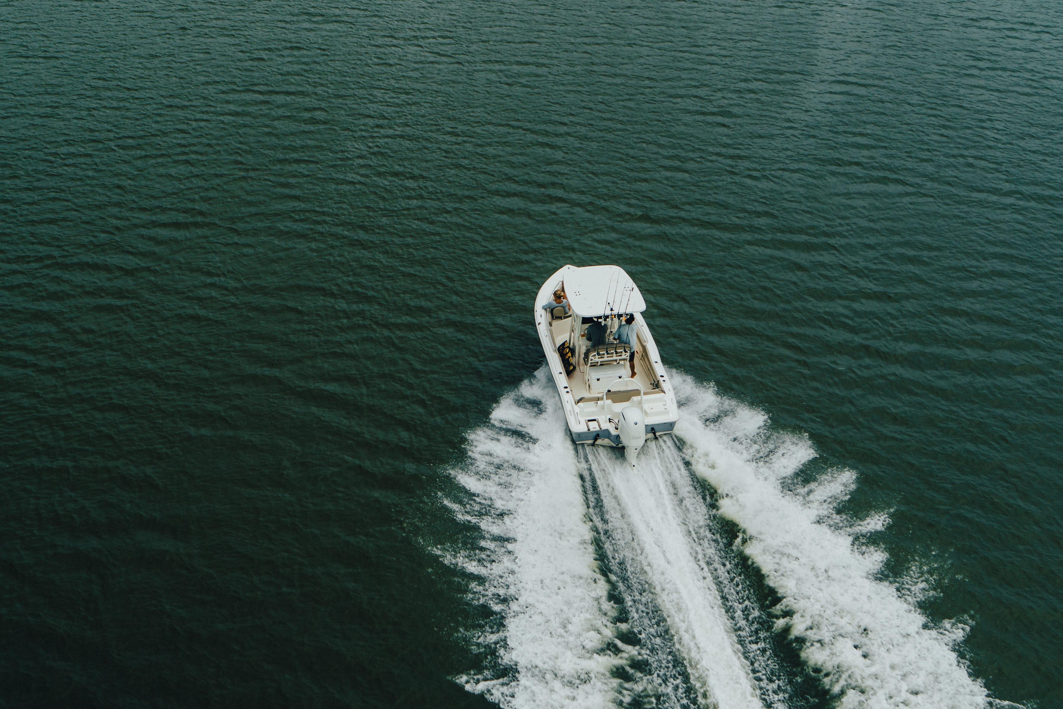 Aerial view of 2026 Key West 239 FS boat cruising on open water.