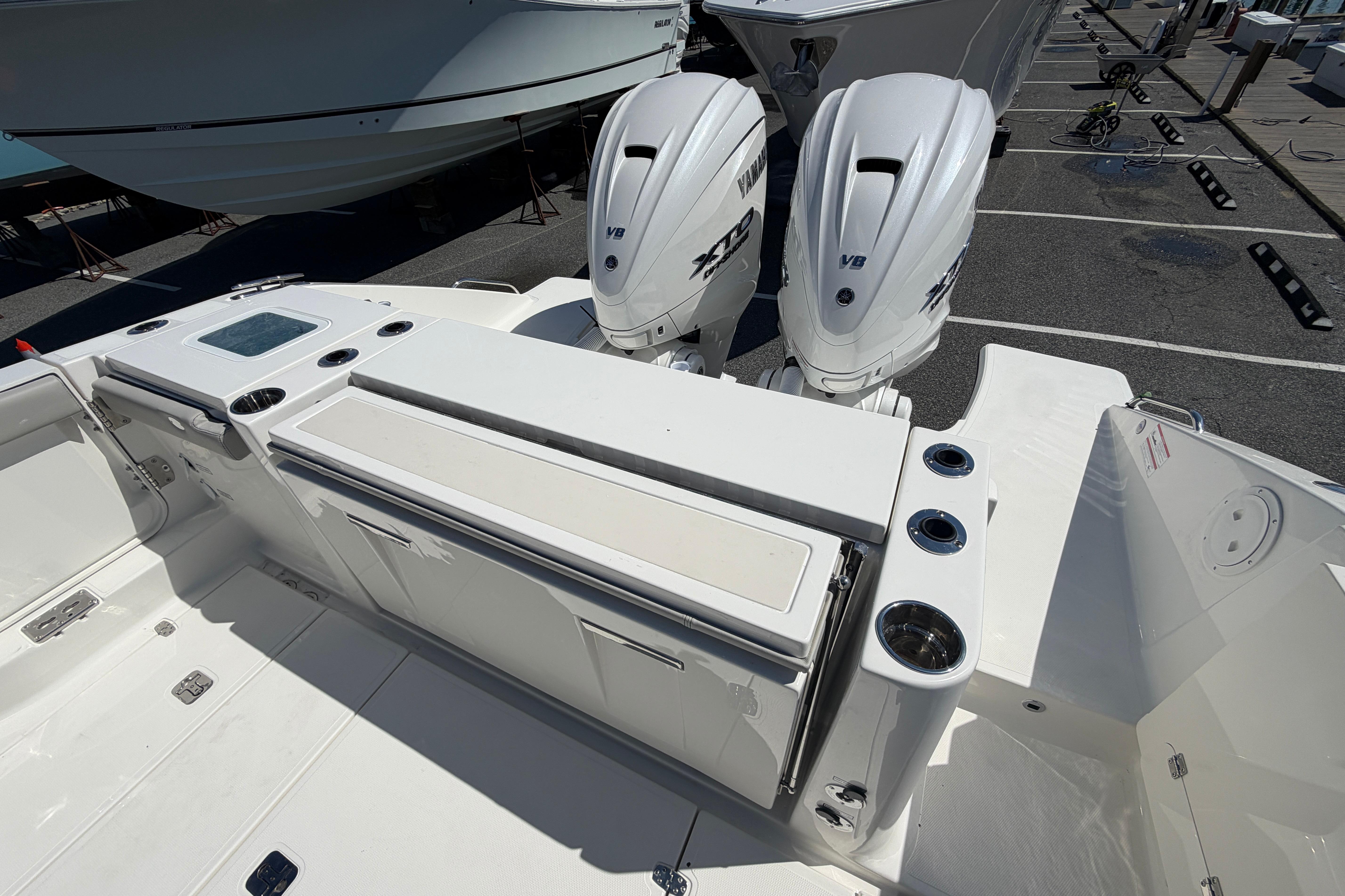 2026 Pursuit S 358 Sport boat with dual outboard engines, sleek deck design.