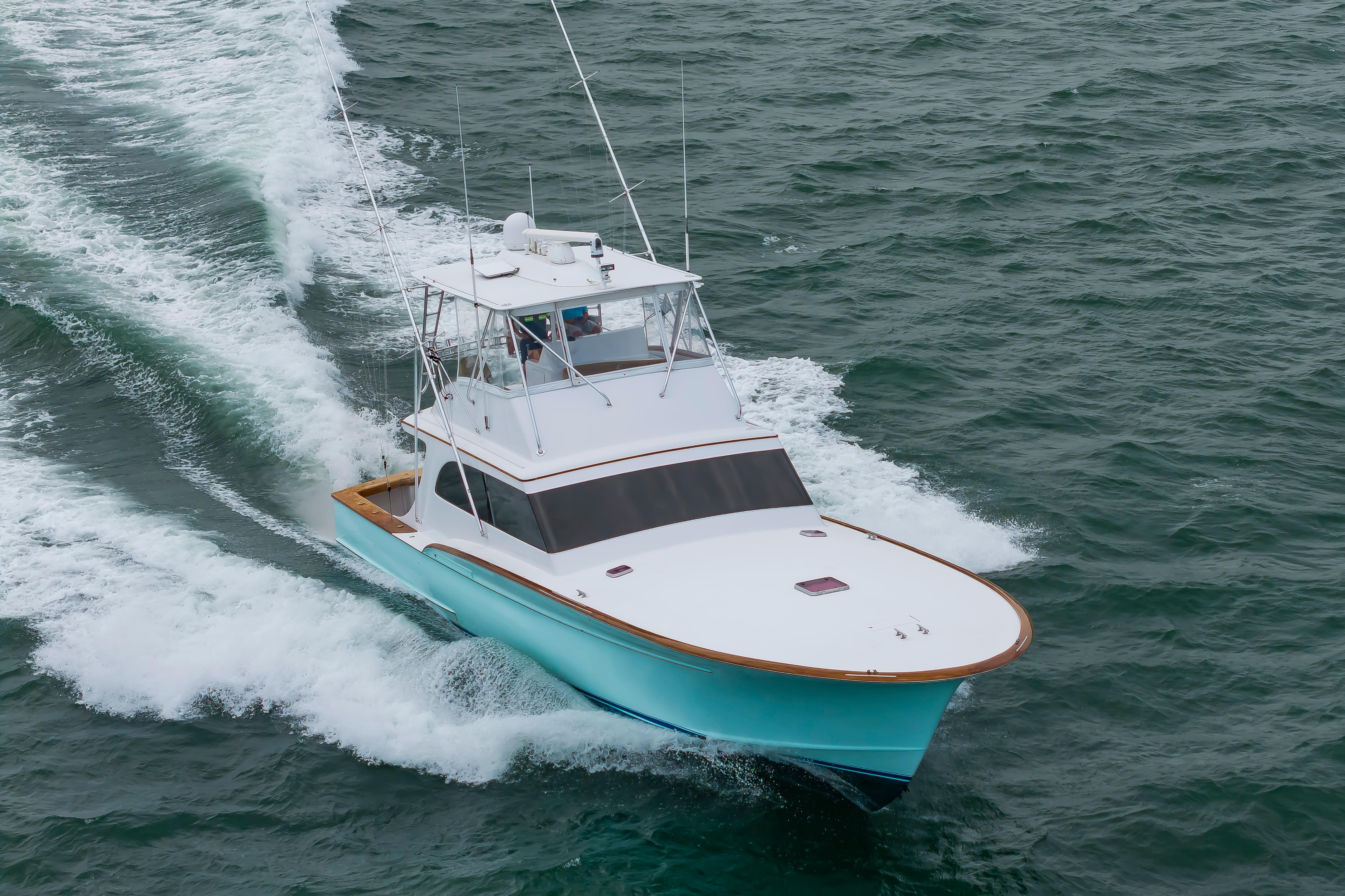Custom Carolina Scarborough 56 Convertible yacht cruising on open water, 1993 model.