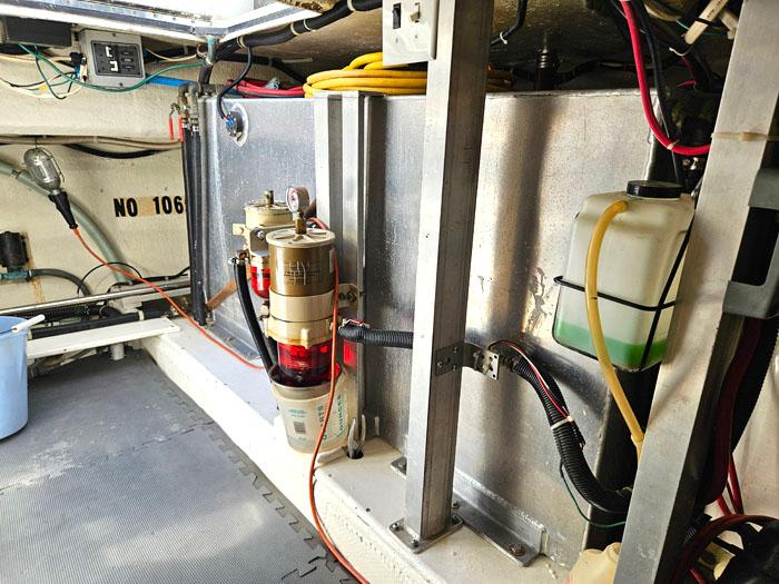 Engine room of 1993 Navigator 4300 with fuel filter and wiring.