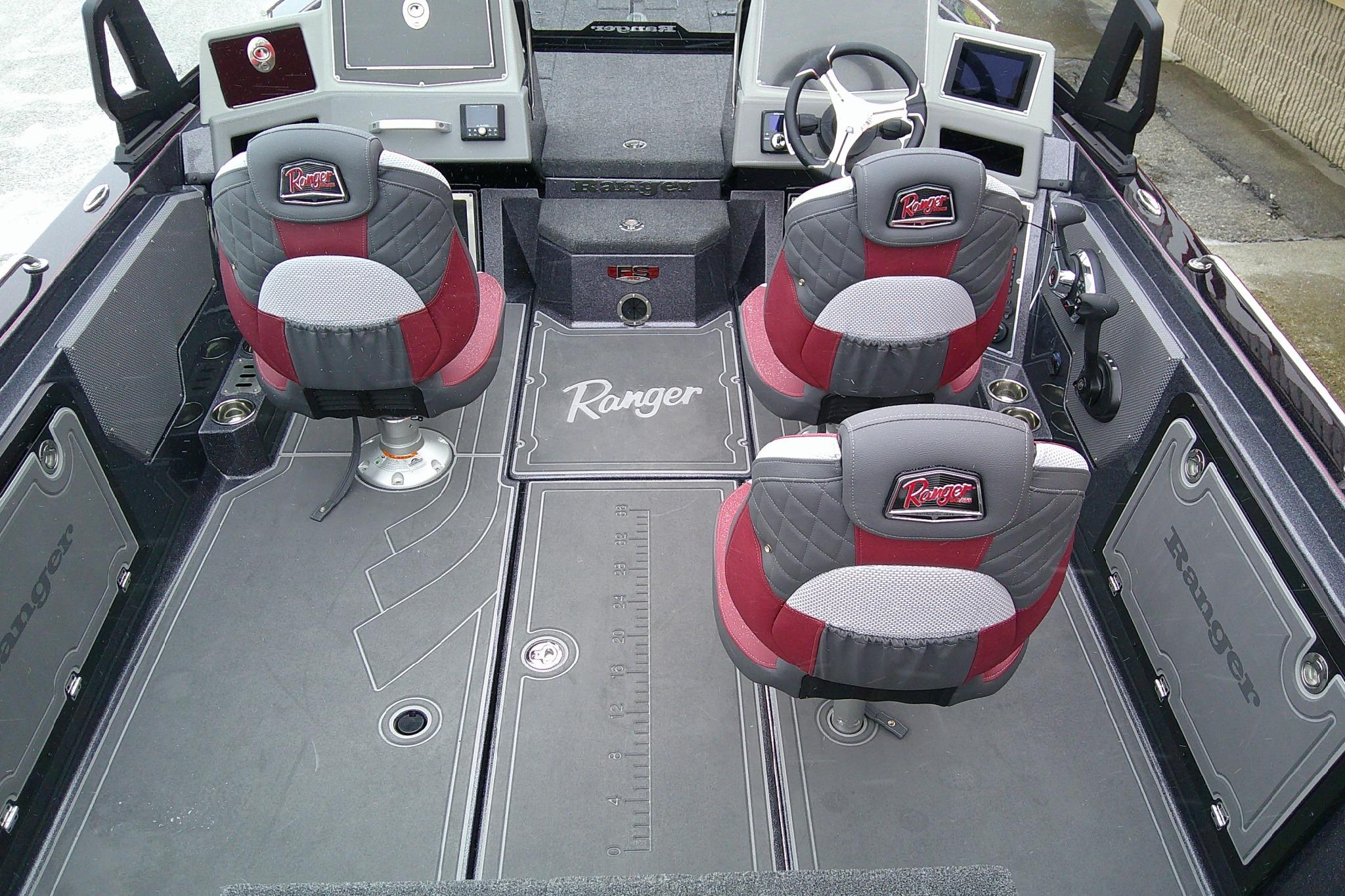 2026 Ranger 620xFS Pro boat interior with red and gray seating, advanced dashboard, and spacious layout.