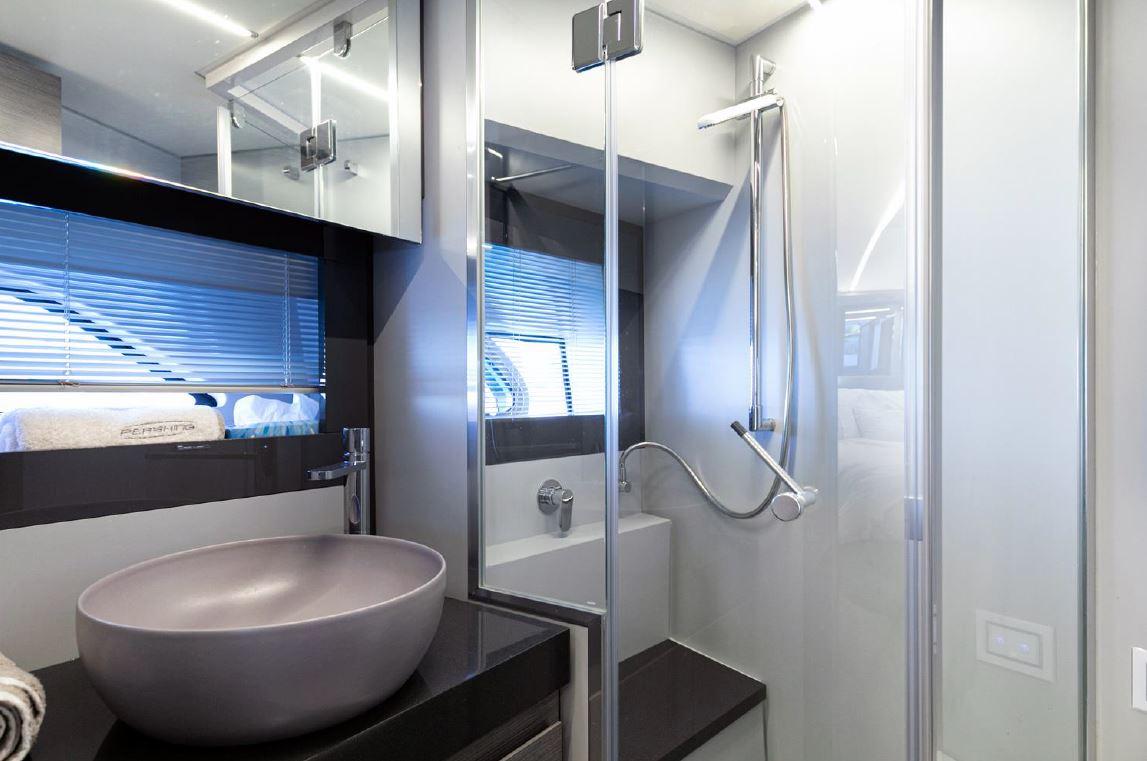 Luxurious bathroom in 2018 Pershing 5x yacht with modern fixtures and sleek design.