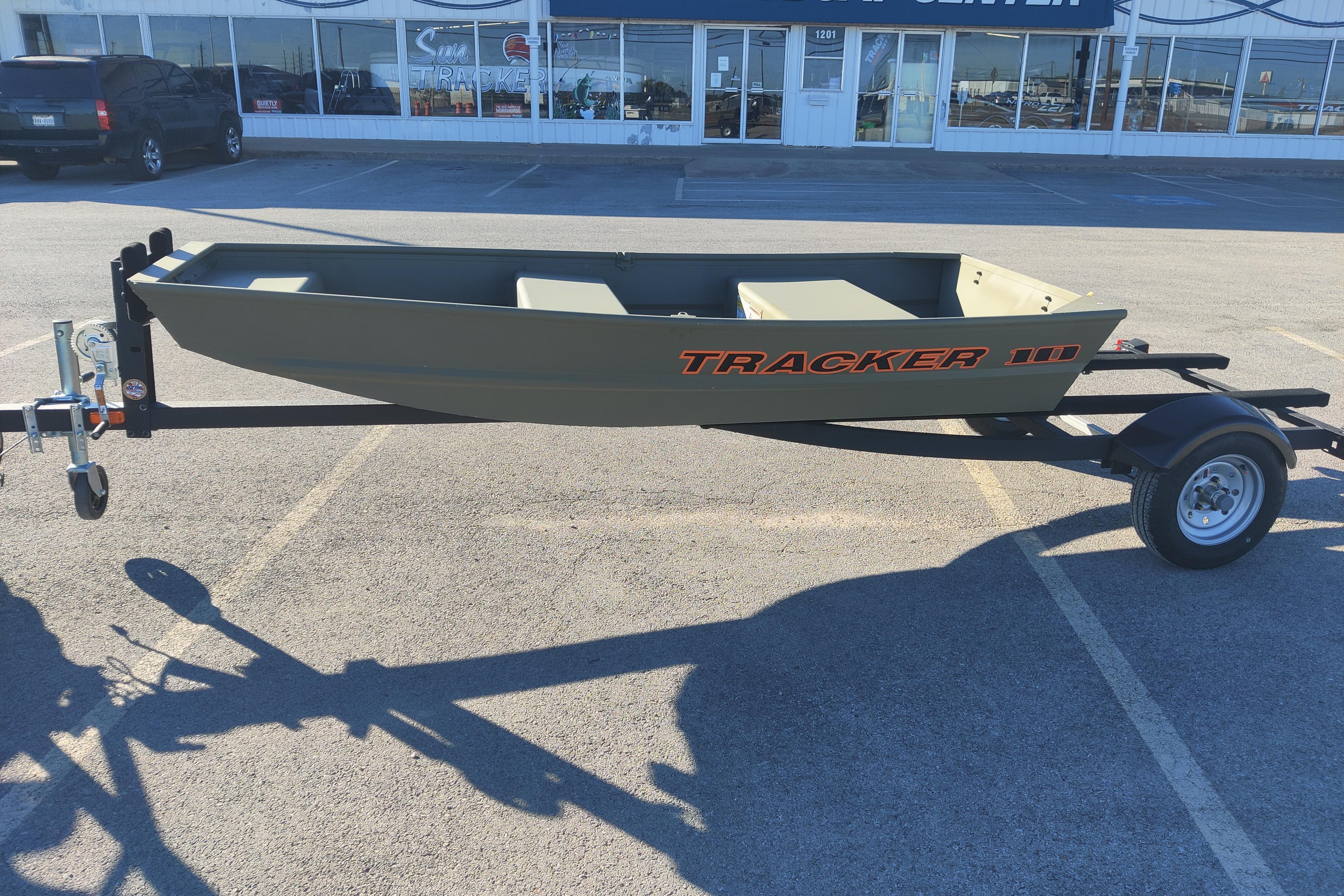 2026 Tracker Grizzly 10 Jon boat on trailer in parking lot.