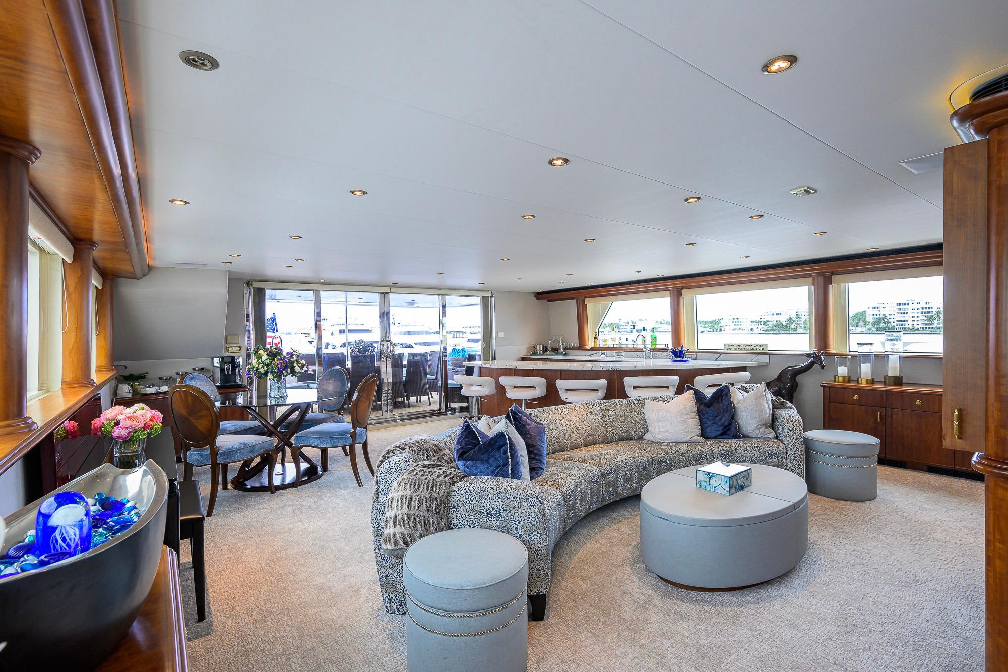 Luxurious 2003 Cheoy Lee Trideck yacht interior with elegant seating and dining area.