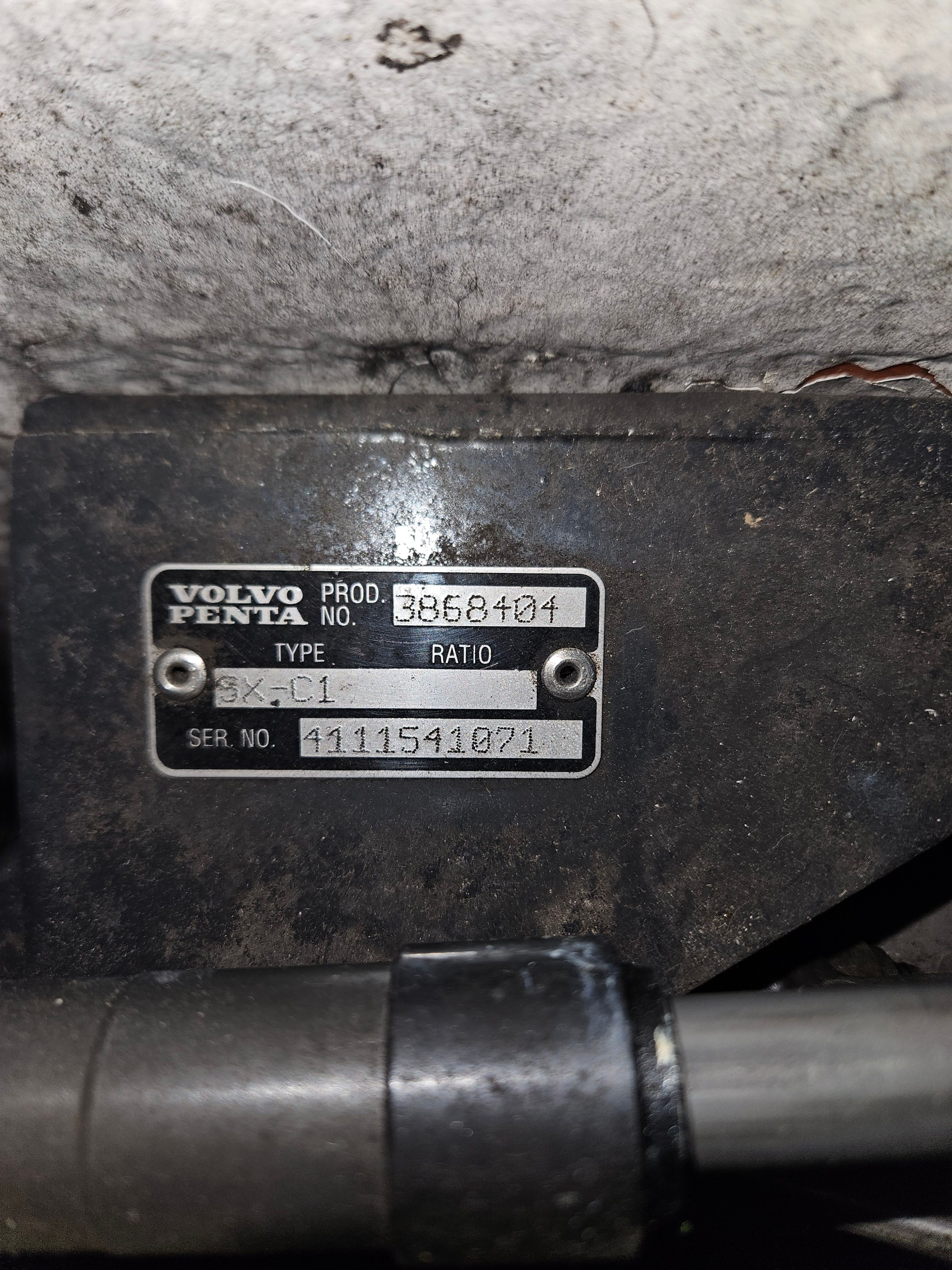 Close-up of a Volvo Penta engine part with serial number.