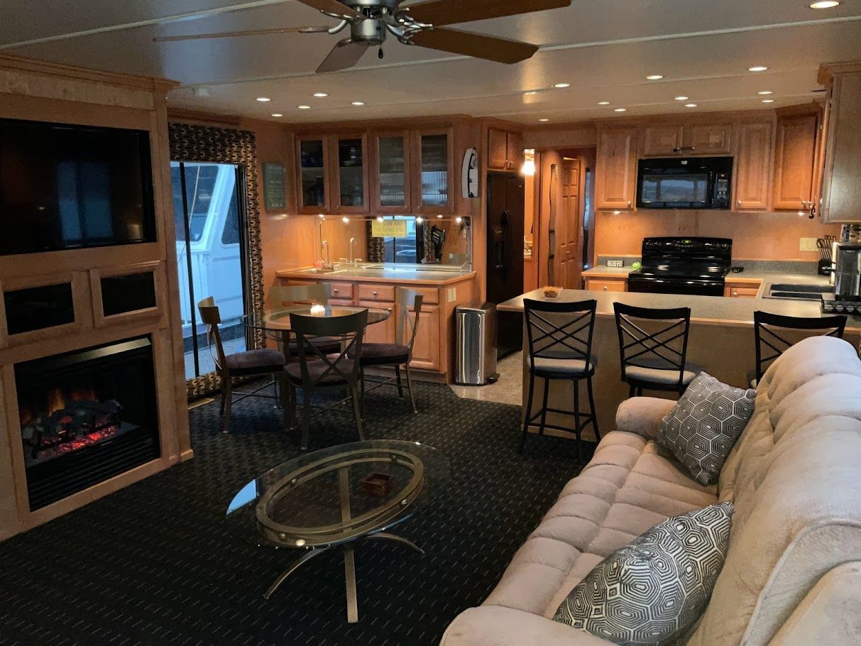 Interior of a 2006 Summersun Houseboat with modern kitchen and cozy living area.