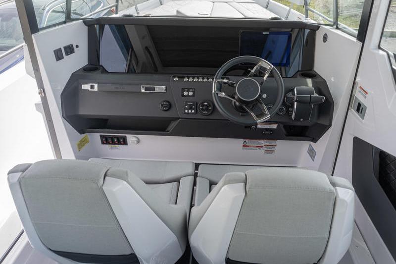 2025 Axopar 29 XC Cross Cabin interior with modern helm and dual seats.