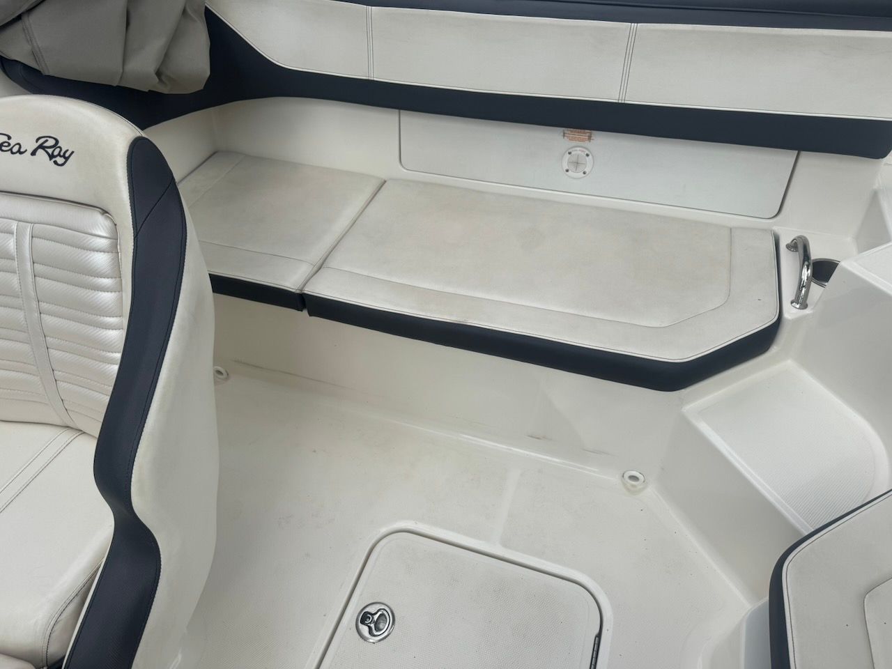 Interior of a 2016 Sea Ray SPX 190 Outboard with white upholstery.