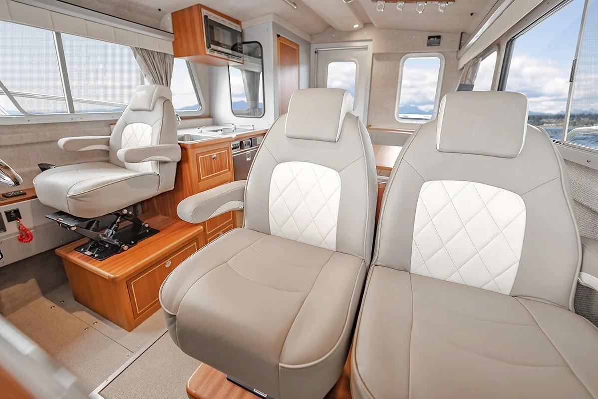 Luxurious interior of 2026 KingFisher 3225 GFX Offshore boat with plush seating.