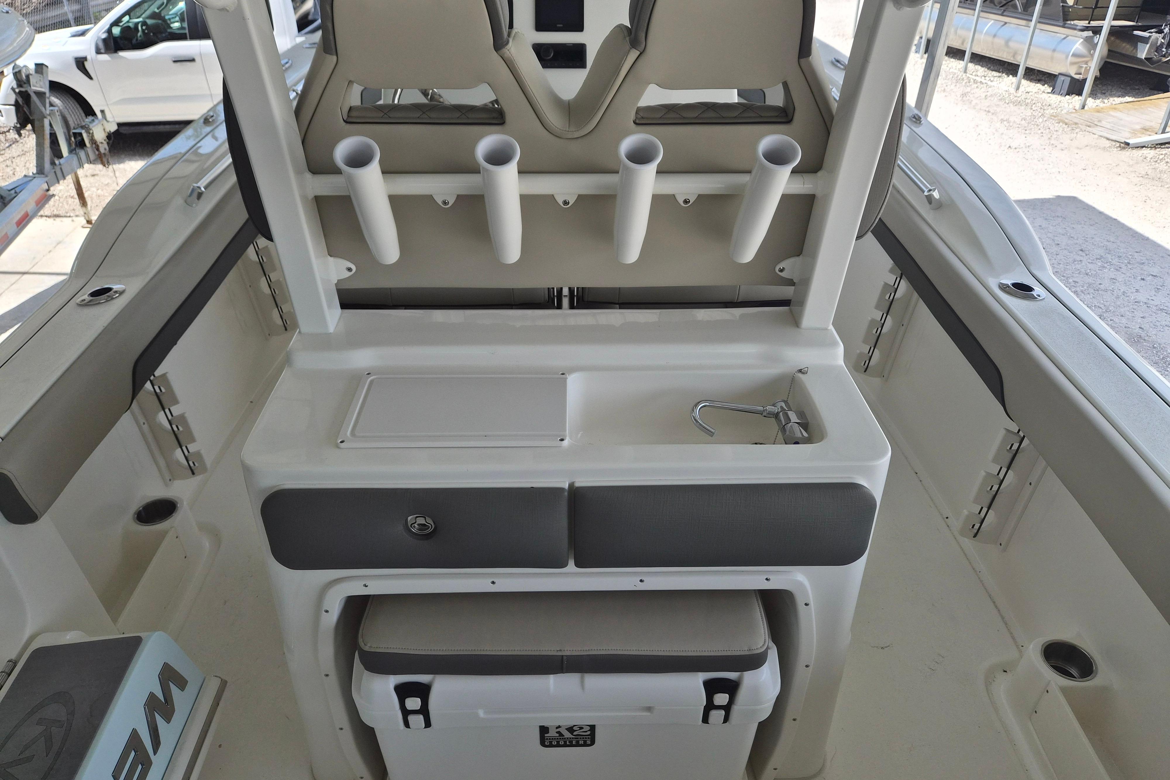 2026 Key West 260 Center Console boat interior with rod holders and storage.