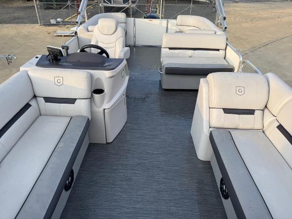 2022 Godfrey 2286 pontoon boat interior with plush seating and steering console.
